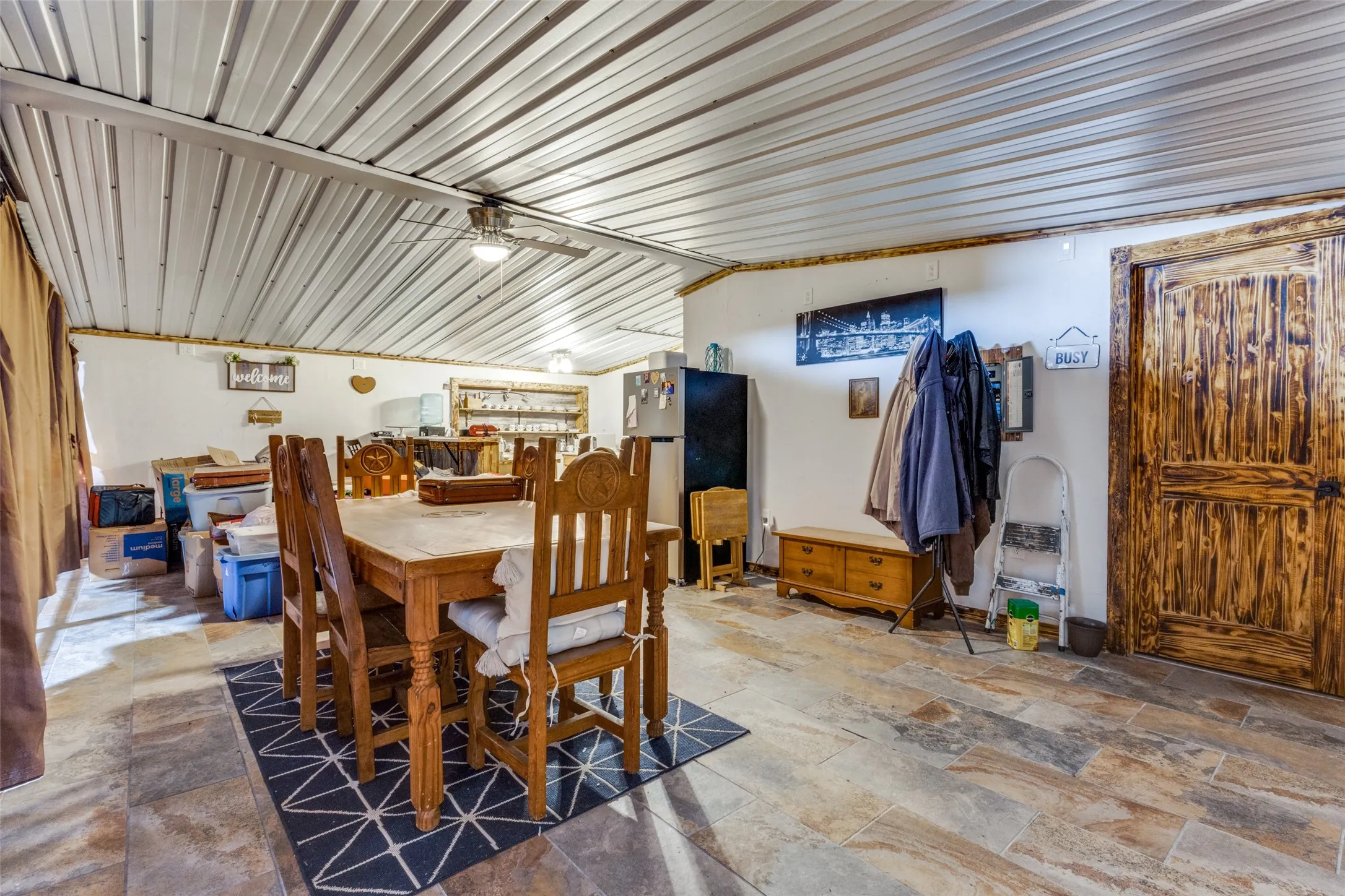 Dining room featuring stone finish flooring
