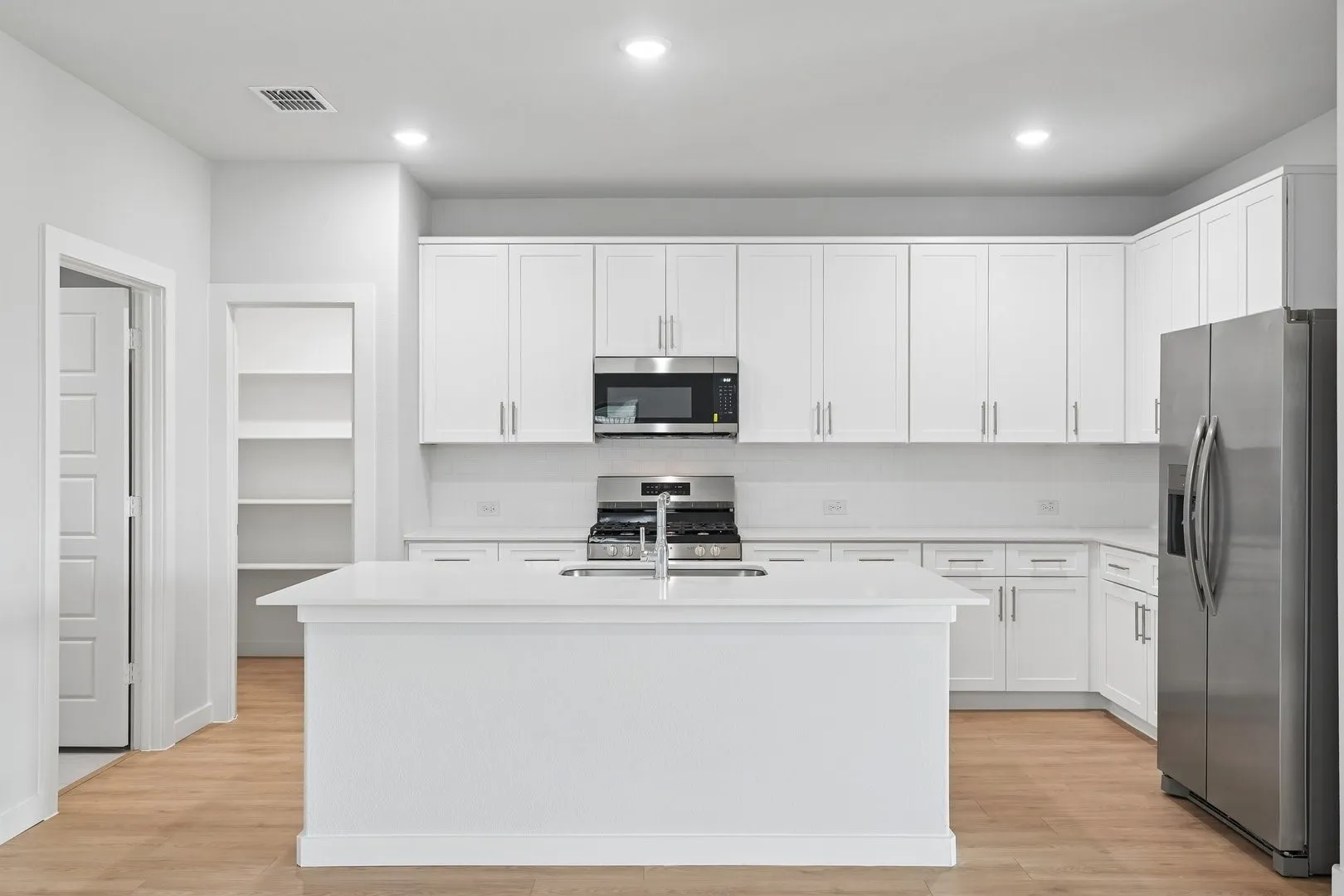 Kitchen in the Hayden home plan by Trophy Signature Homes