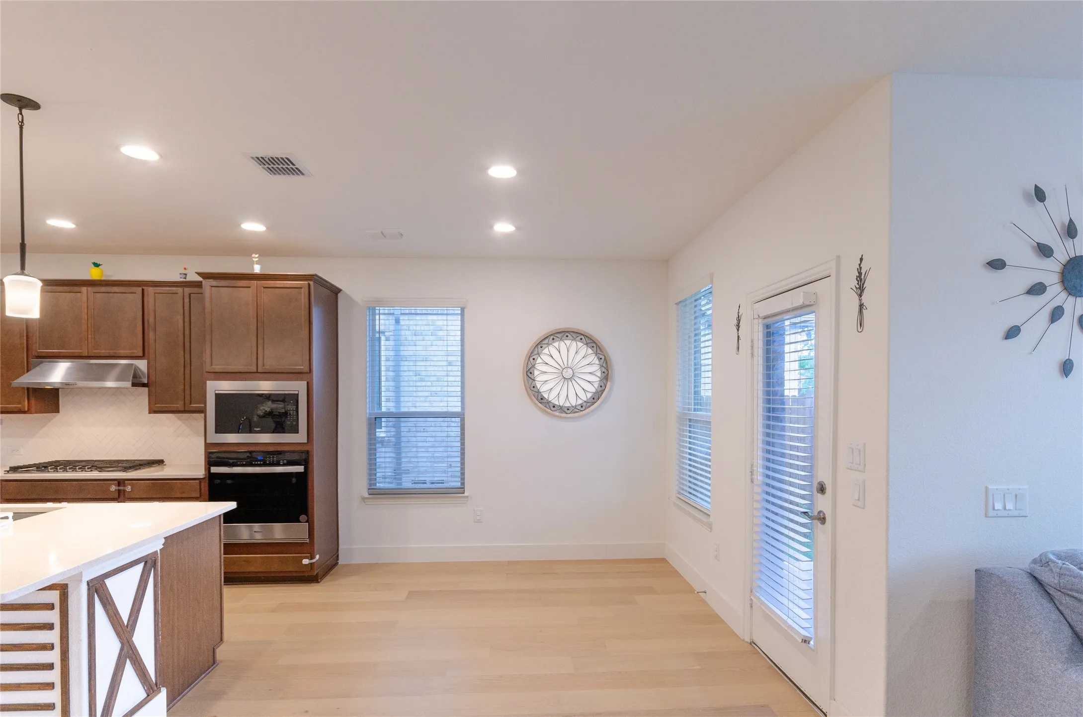 Breakfast area & Kitchen and dining area featuring light wood-finish flooring