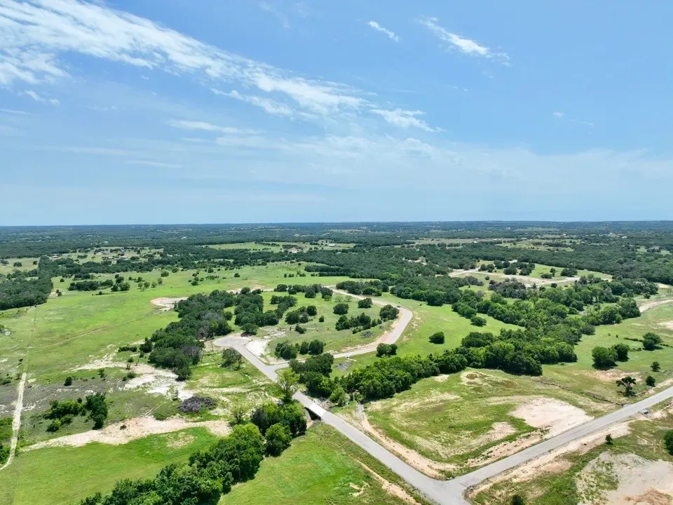 Birds eye view of property featuring a rural view