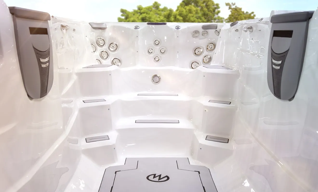 Impressive 19-foot dual-zone swim spa with a dedicated aquatic exercise area and separate contoured hot tub.