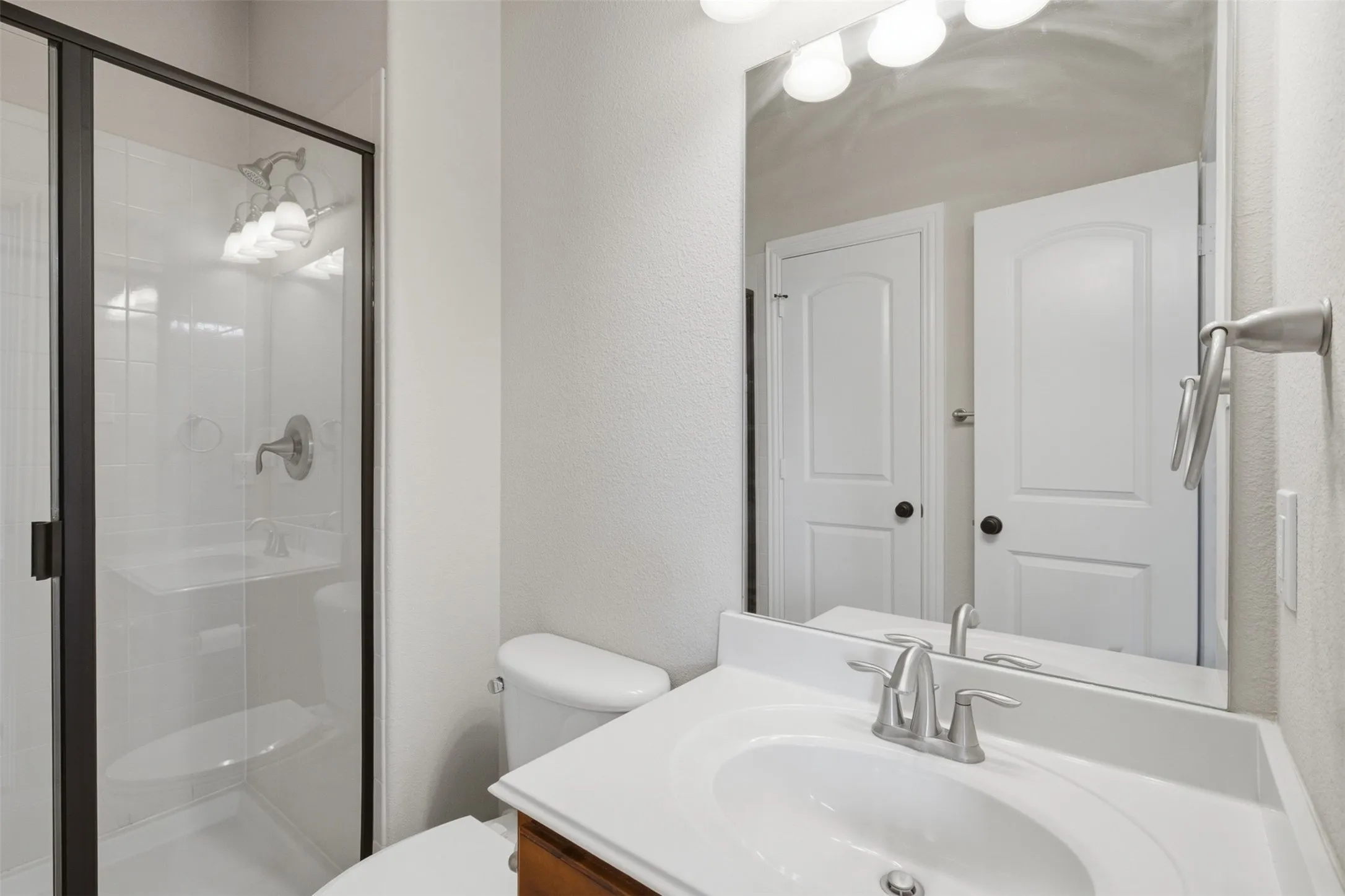 Upstairs full bathroom serves the private bedroom and game-room retreat.