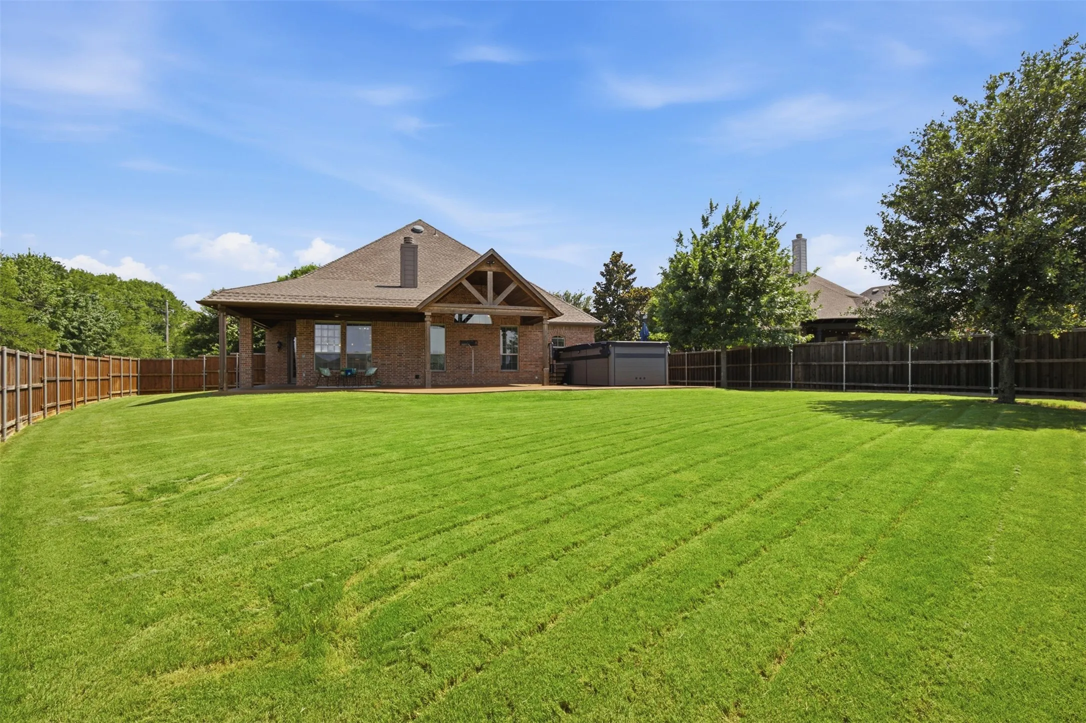 Oversized private backyard with greenbelt views, expansive yard, and room for recreation, gardening, or entertaining.