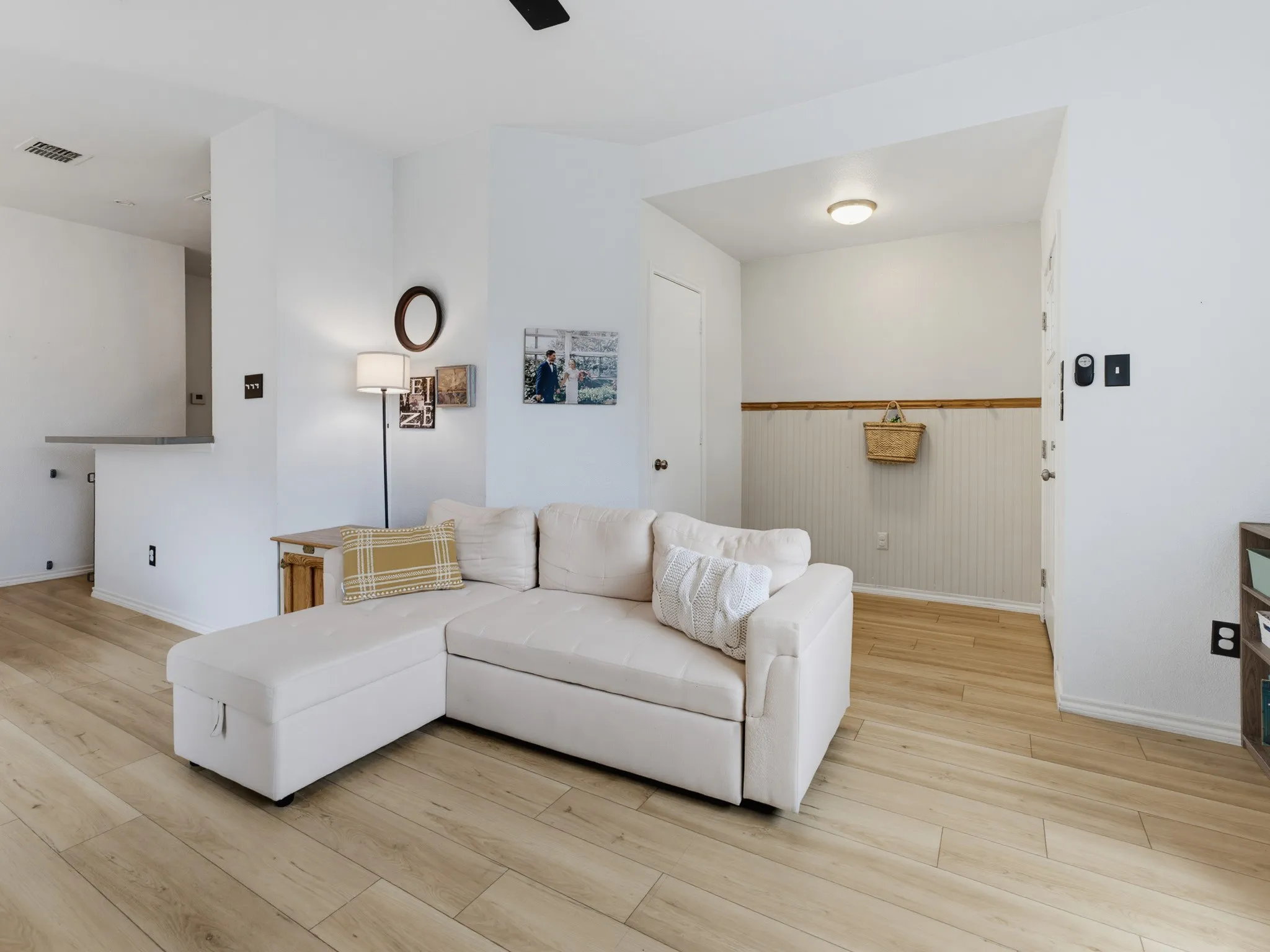Open concept living space featuring wood-finish flooring throughout