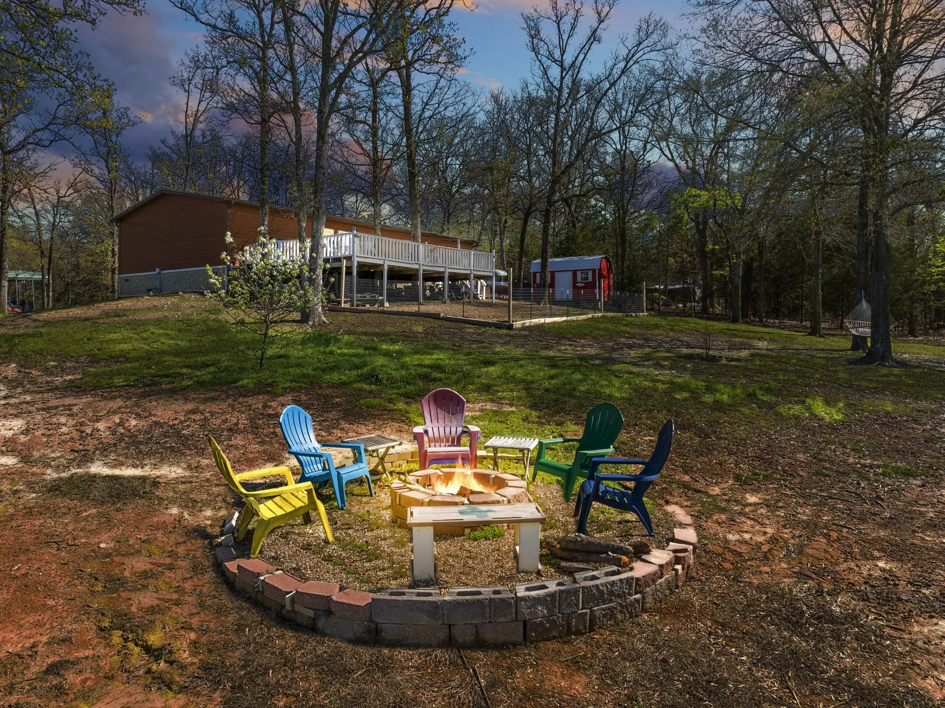 Yard at dusk with a fire pit