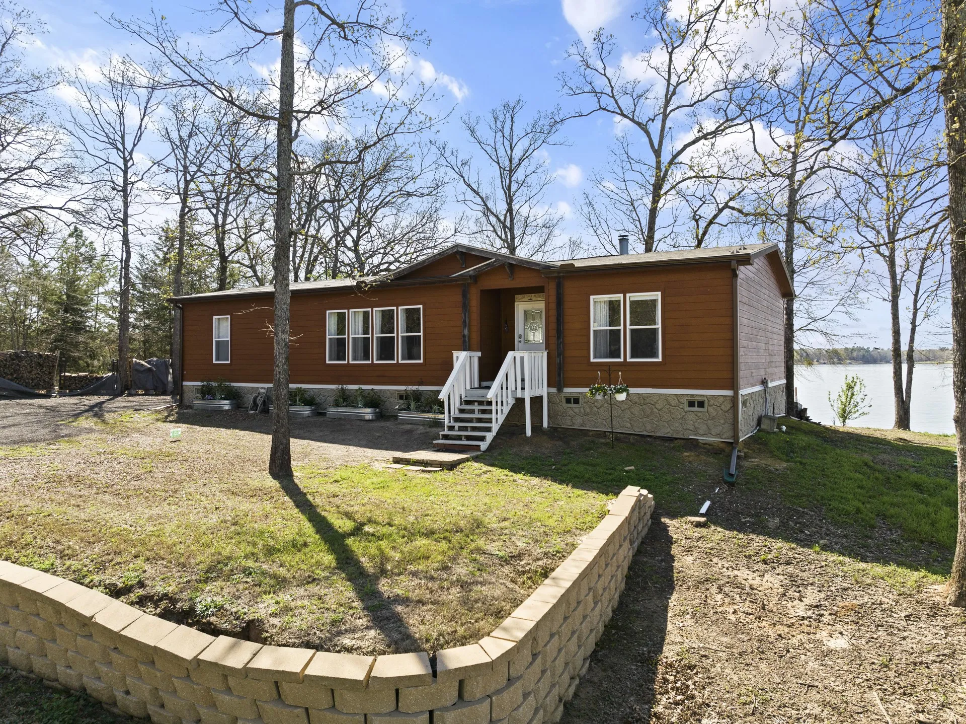 View of front of property featuring a front yard and a water view