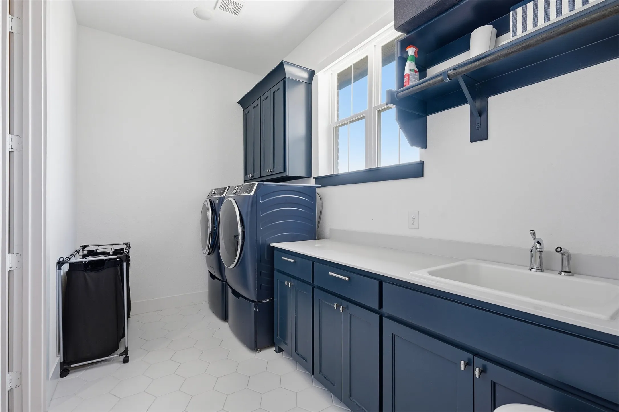 Laundry room with dedicated sink