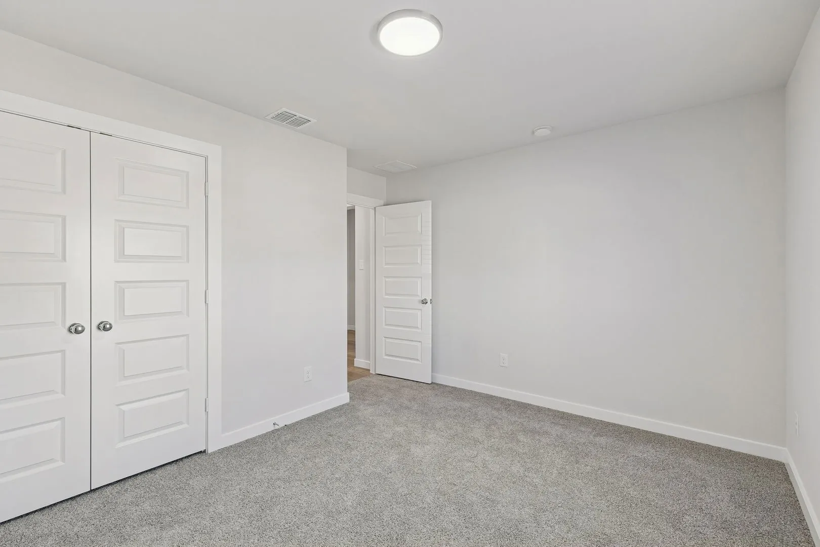 Bedroom in the Harrison home plan by Trophy Signature Homes – REPRESENTATIVE PHOTO