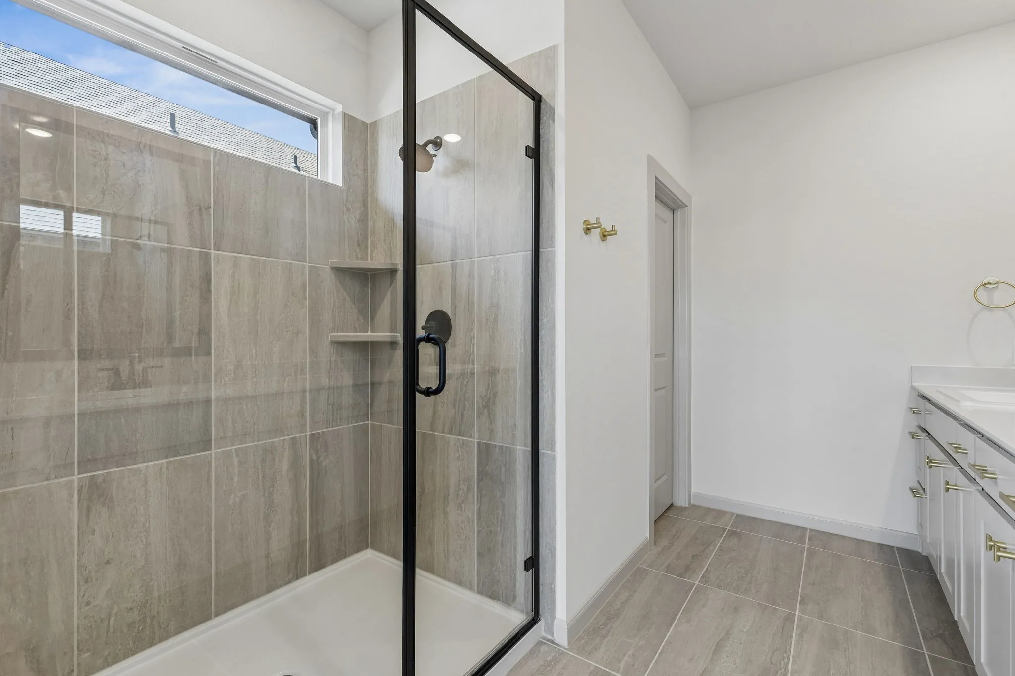 Featuring an oversized walk in shower, long luxurious showers are in your future!