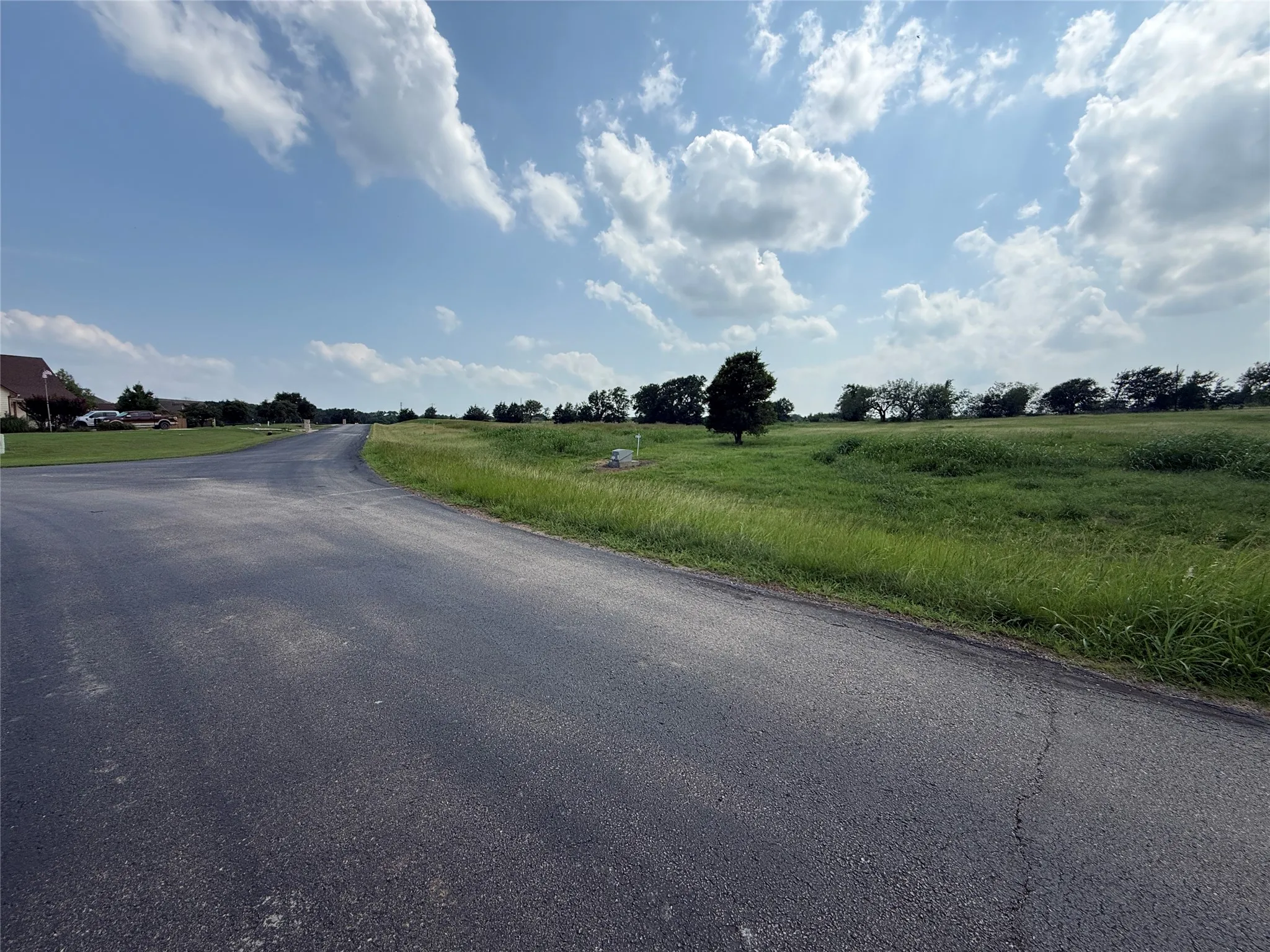 Asphalt road frontage provides convenient access to the property.