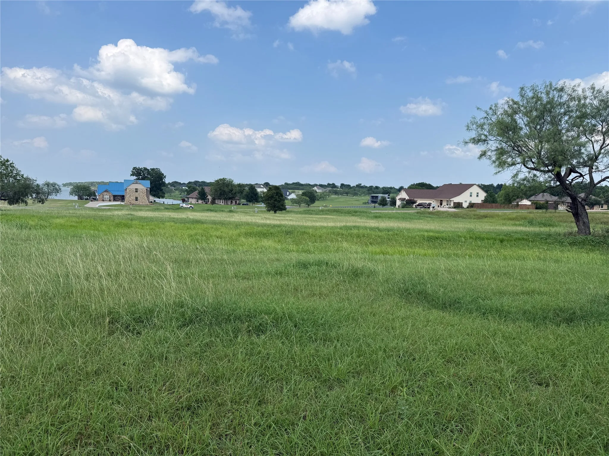 Scenic view across the neighborhood toward surrounding homesites.