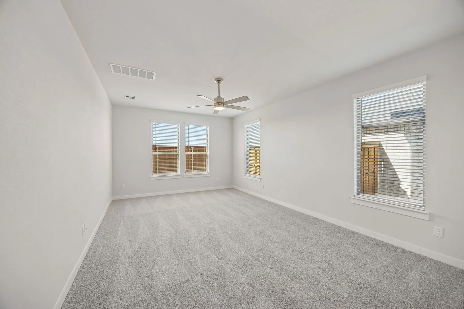 Primary Suite in the Wimbledon home plan by Trophy Signature Homes – REPRESENTATIVE PHOTO
