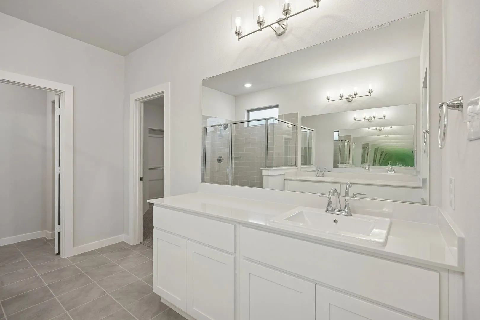 Primary Bathroom in the Wimbledon home plan by Trophy Signature Homes – REPRESENTATIVE PHOTO