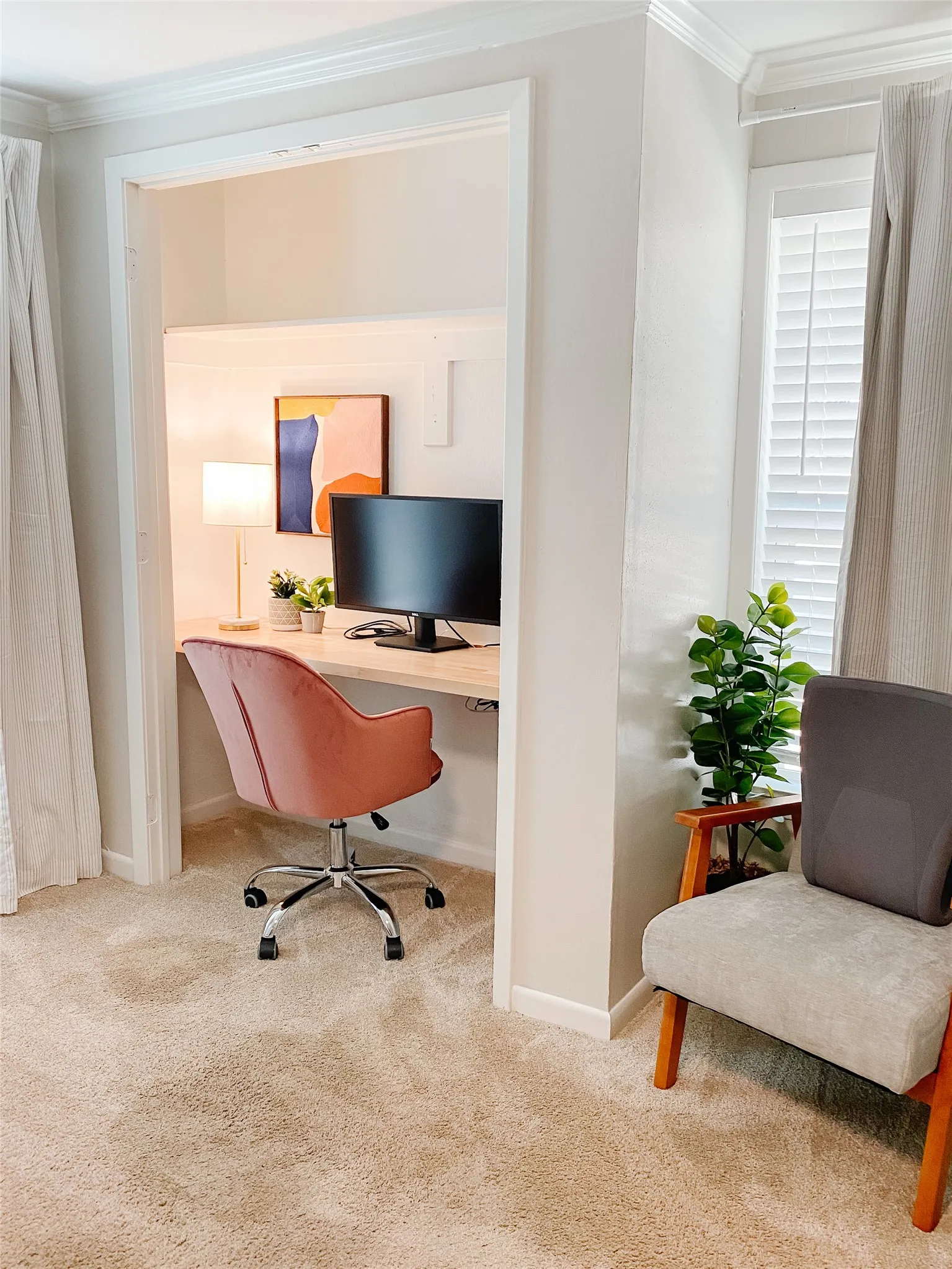 Built-in desk nook featuring a light wood-finish countertop, recessed lighting, and crown molding