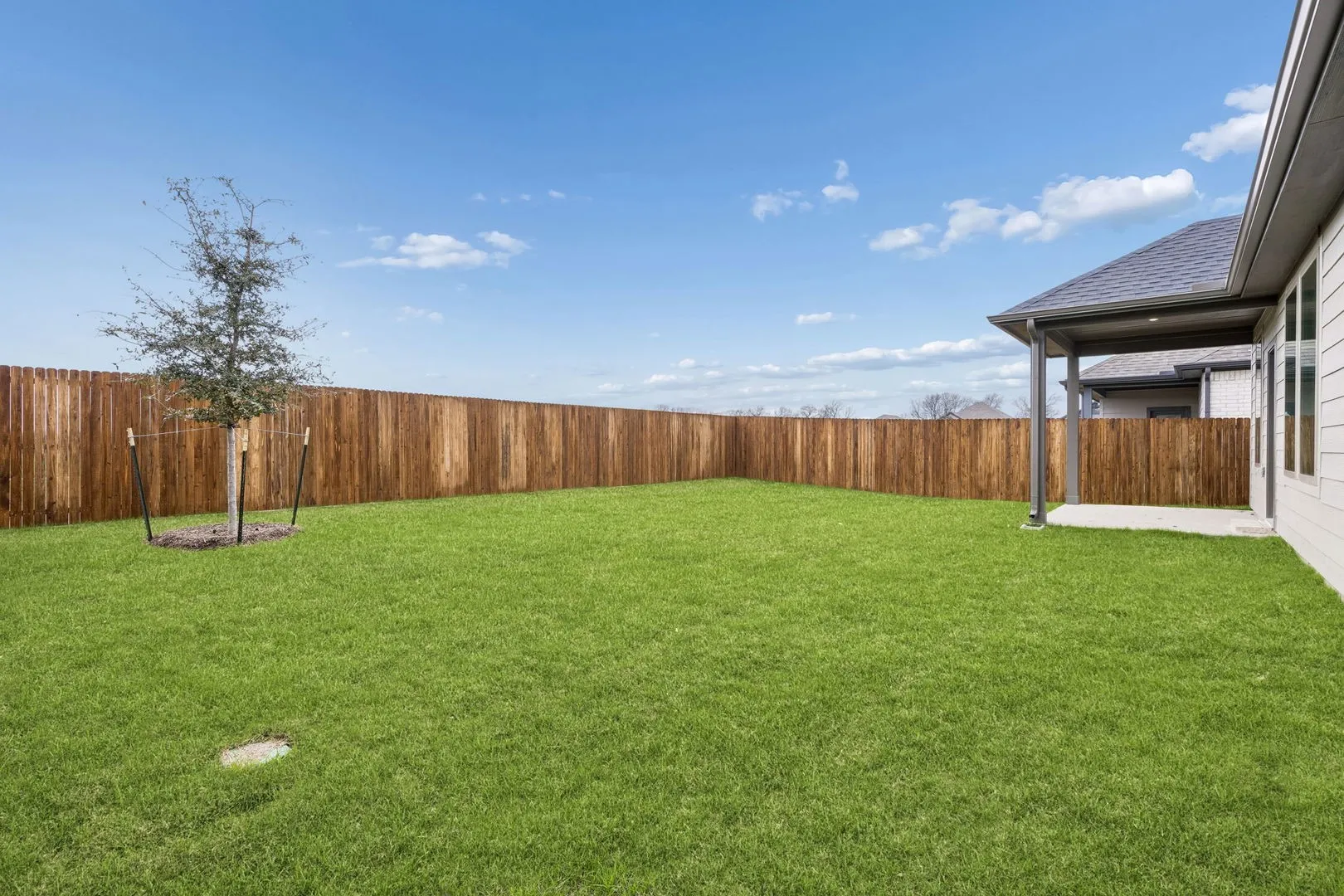 Covered Patio in the Winters home plan by Trophy Signature Homes – REPRESENTATIVE PHOTO