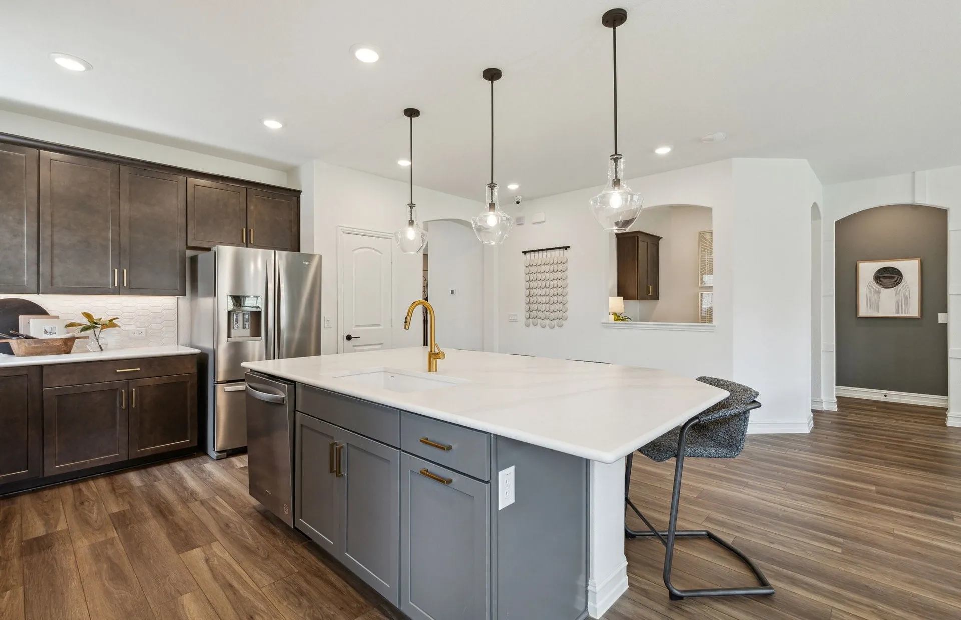 *Model Representation - Large island overlooking gathering room and dining areas