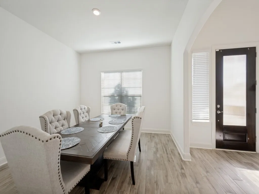 Upon entering the home, guests are greeted by an oversized entry as well as the spacious formal dining room. Notice the beautiful-look tile floors.