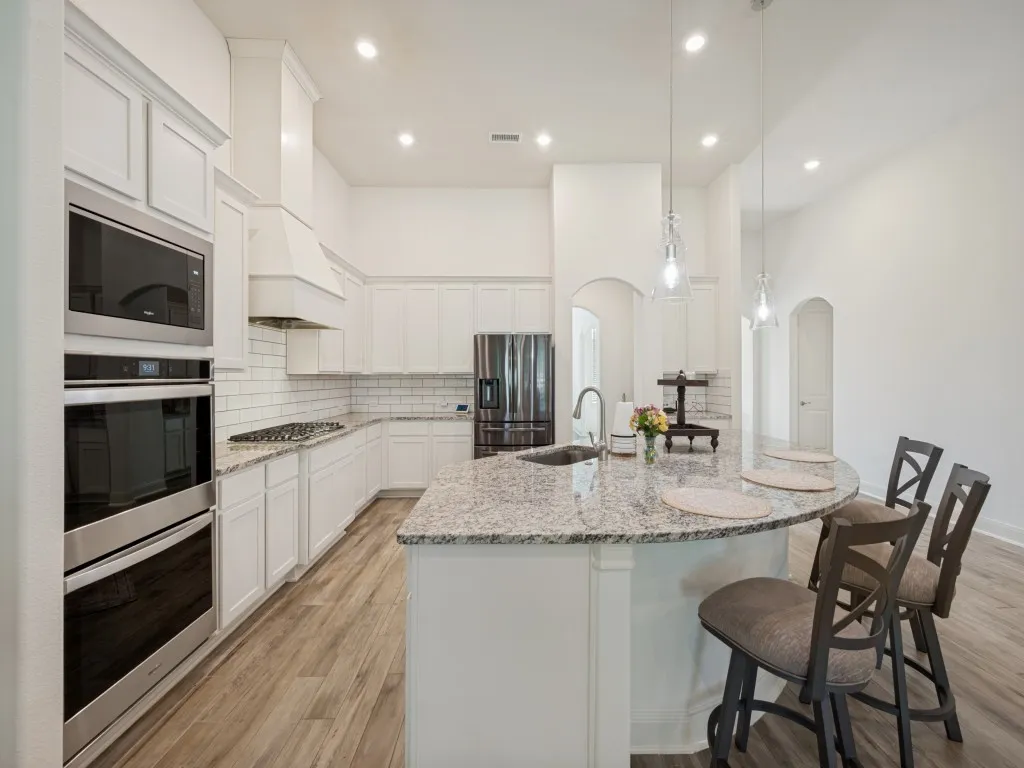 The kitchen is thoughtfully laid out. Plenty of room for family and friends to gather.  Plenty of room to create beautiful meals and for holiday baking.