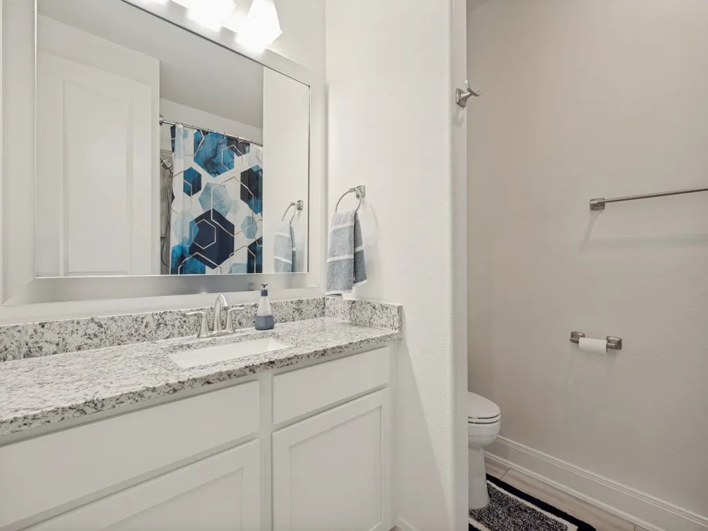 Guest bathroom for 2nd and 3rd guest rooms; has a tub/shower combo and linen closet for storing sheets, towels, and extra toiletries.