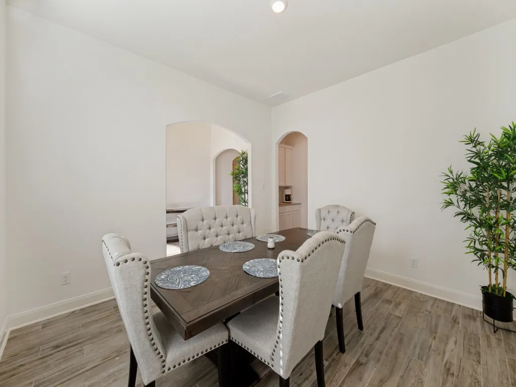The dining room is to the right of the entry and there is a well-placed butlers pantry between the dining room and the kitchen. Plenty of room for your large dining table and buffet.