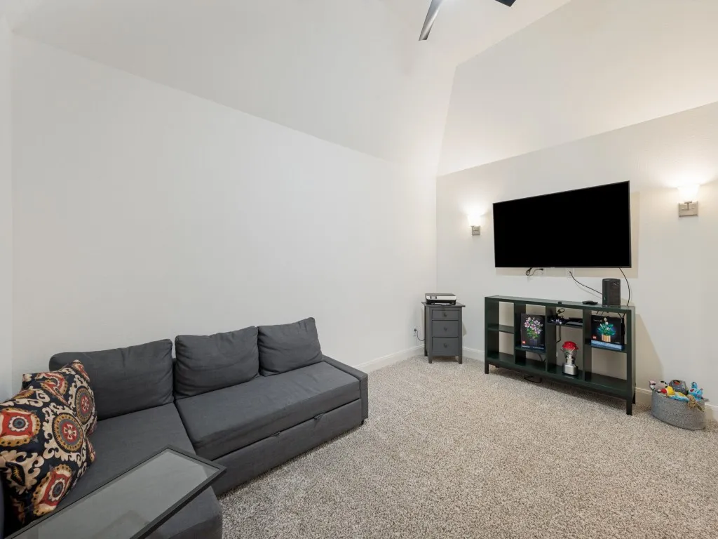 This second living area has double door access and a closet.  It can easily be used as a media room, home office, or even a fifth bedroom.