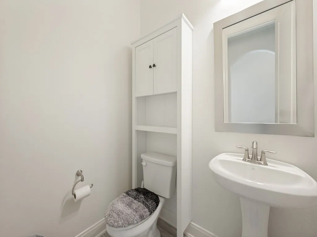 The half bath is conveniently located off the kitchen and main living area.