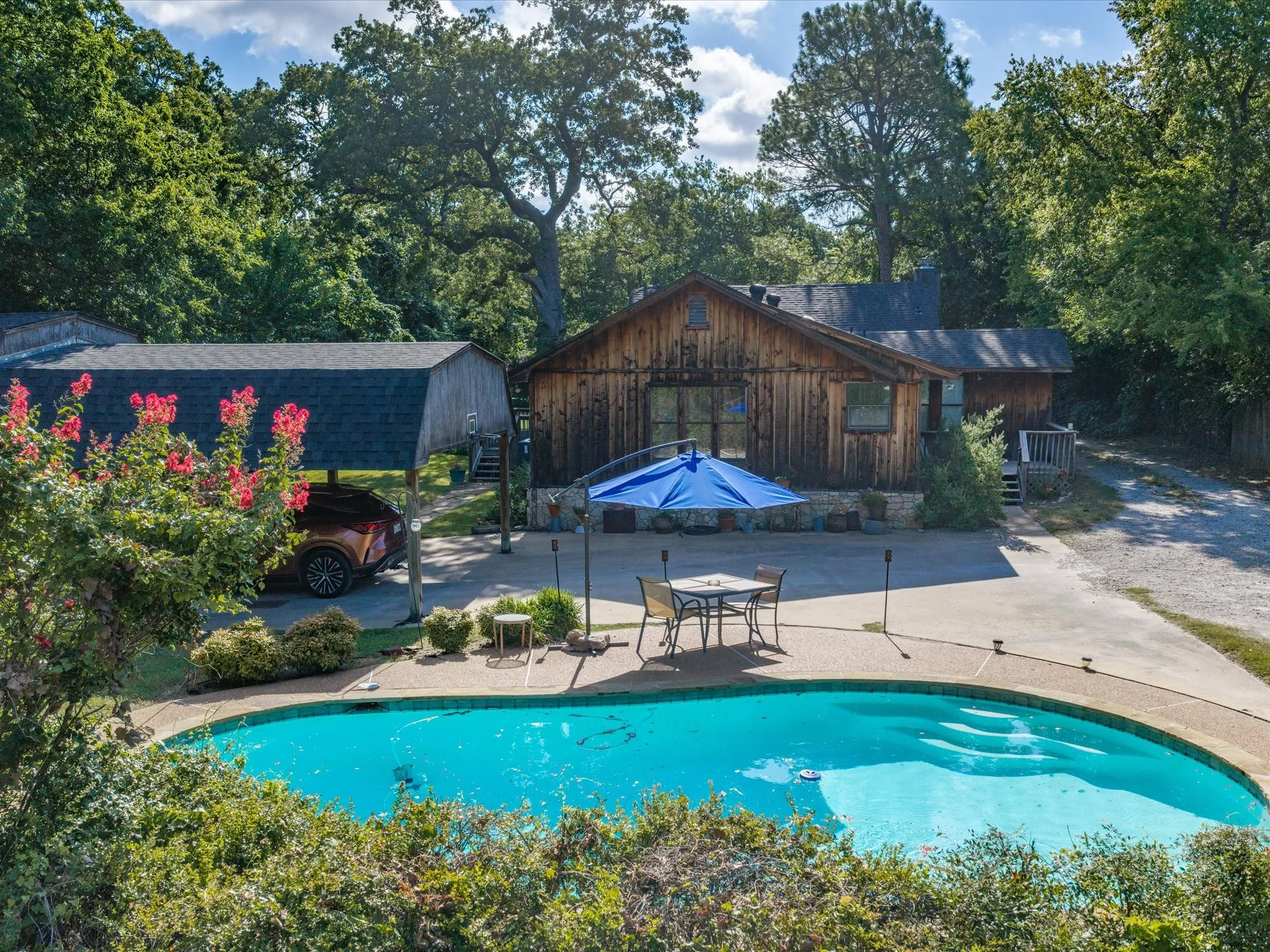 Inviting inground swimming pool with integrated steps and surrounding concrete patio