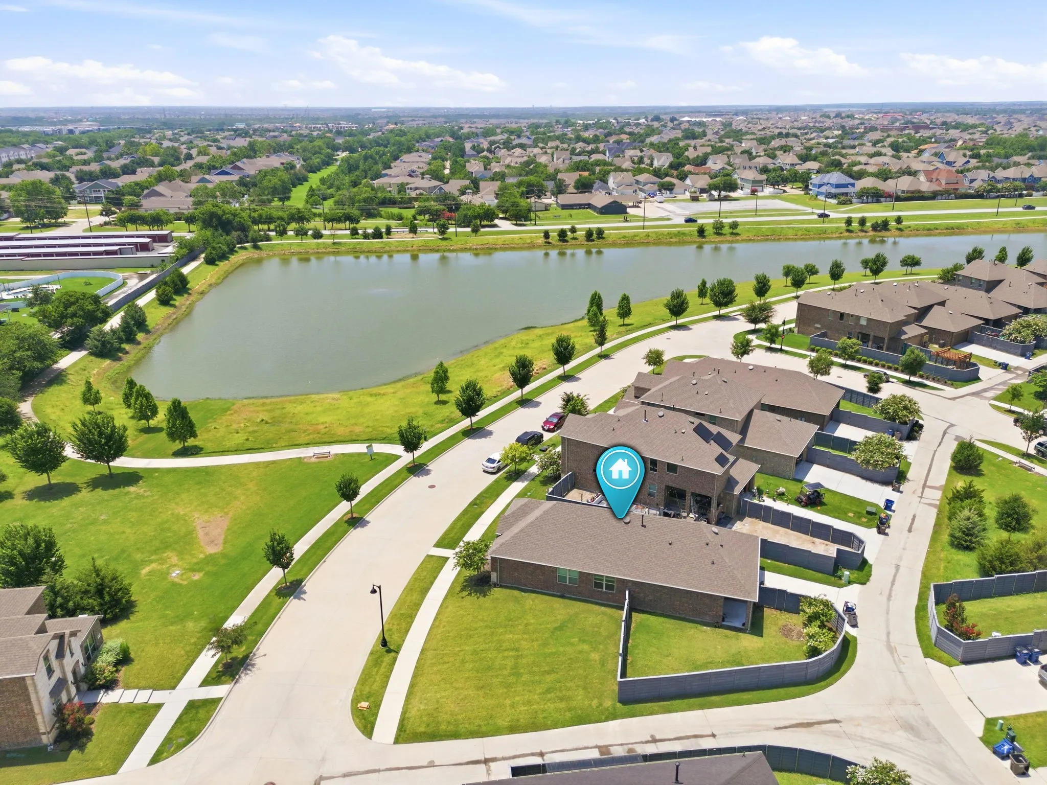 Aerial perspective showcasing a residential community with a prominent lake