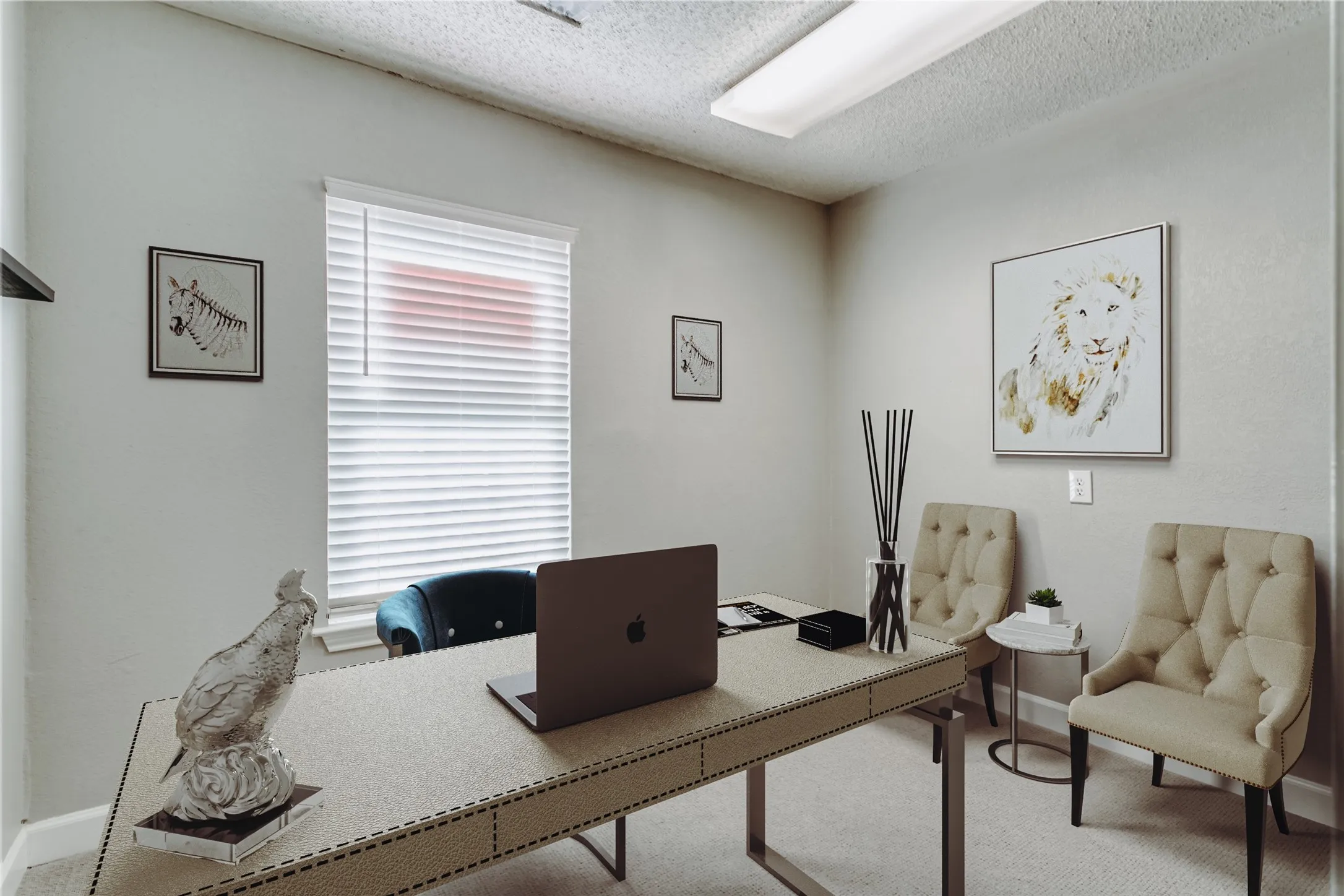Dedicated room featuring a large window with horizontal blinds, neutral wall paint, and a textured ceiling