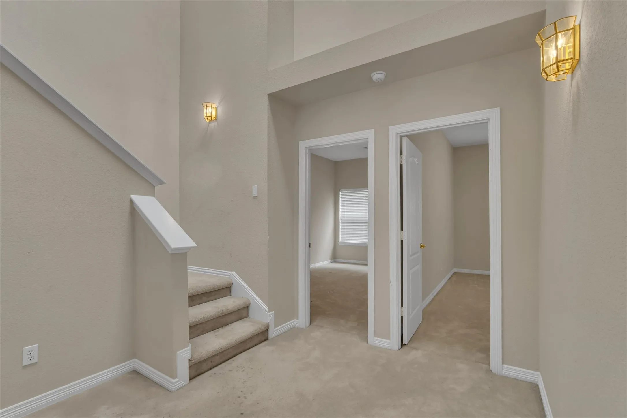 view of staircase and 3rd & 4th downstairs bedrooms