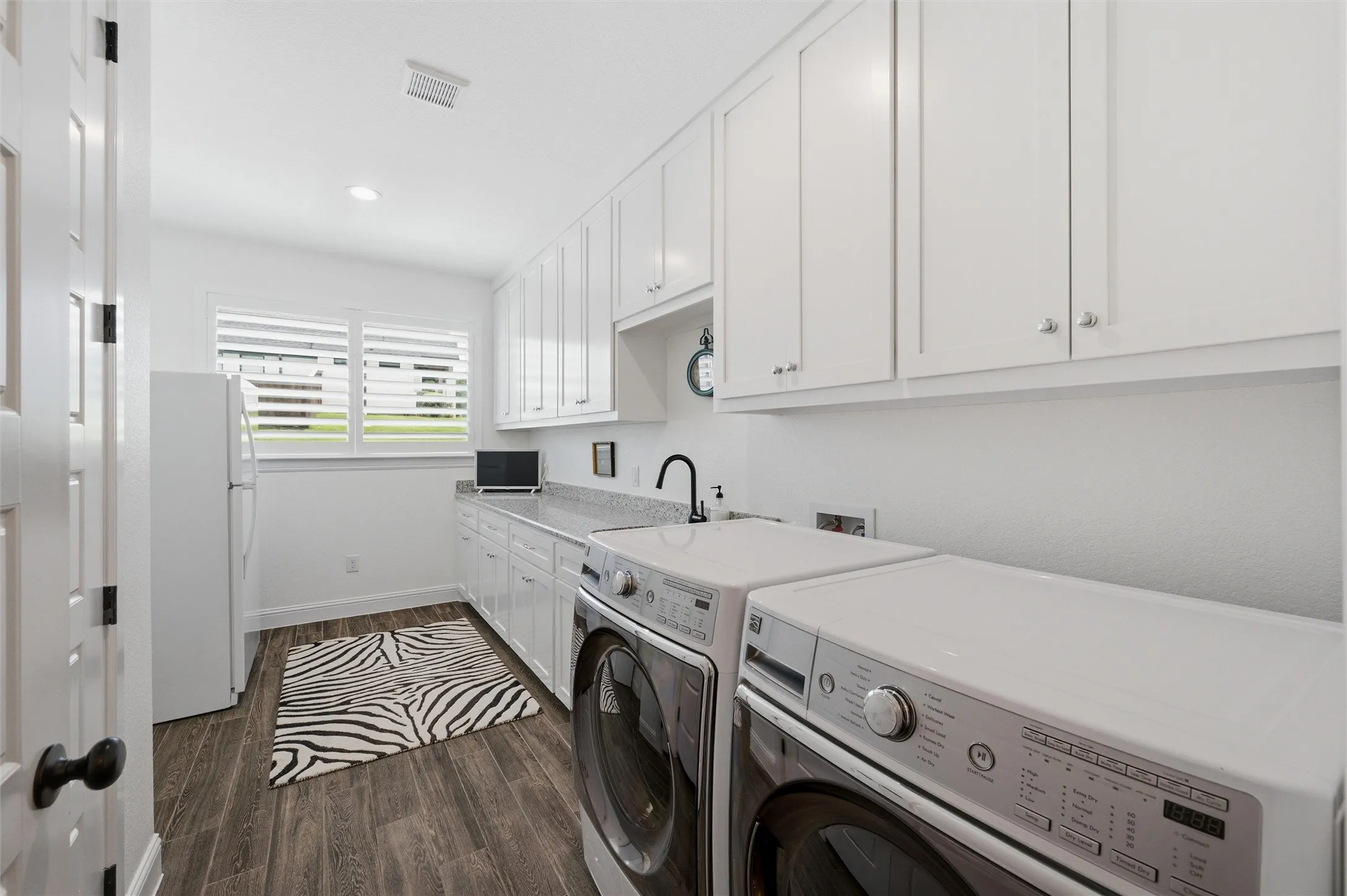 Huge laundry with sink and room for fridge