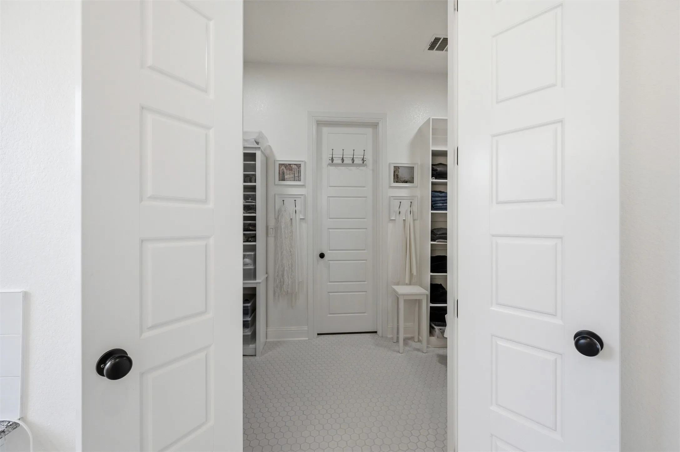 Primary bathroom has direct access to closet and laundry room.