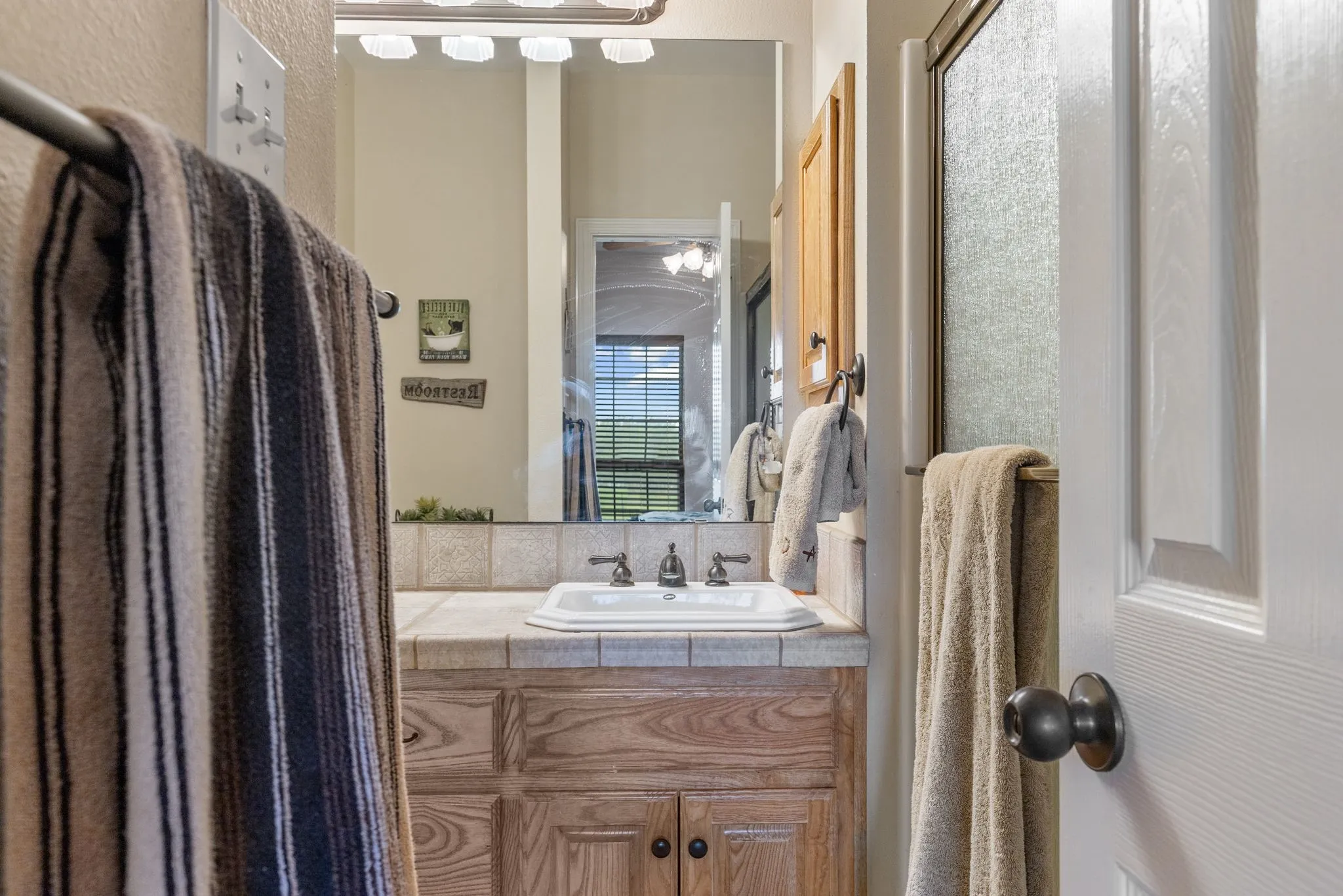 Secondary bath can be accessed off the hallway and one of the bedrooms.