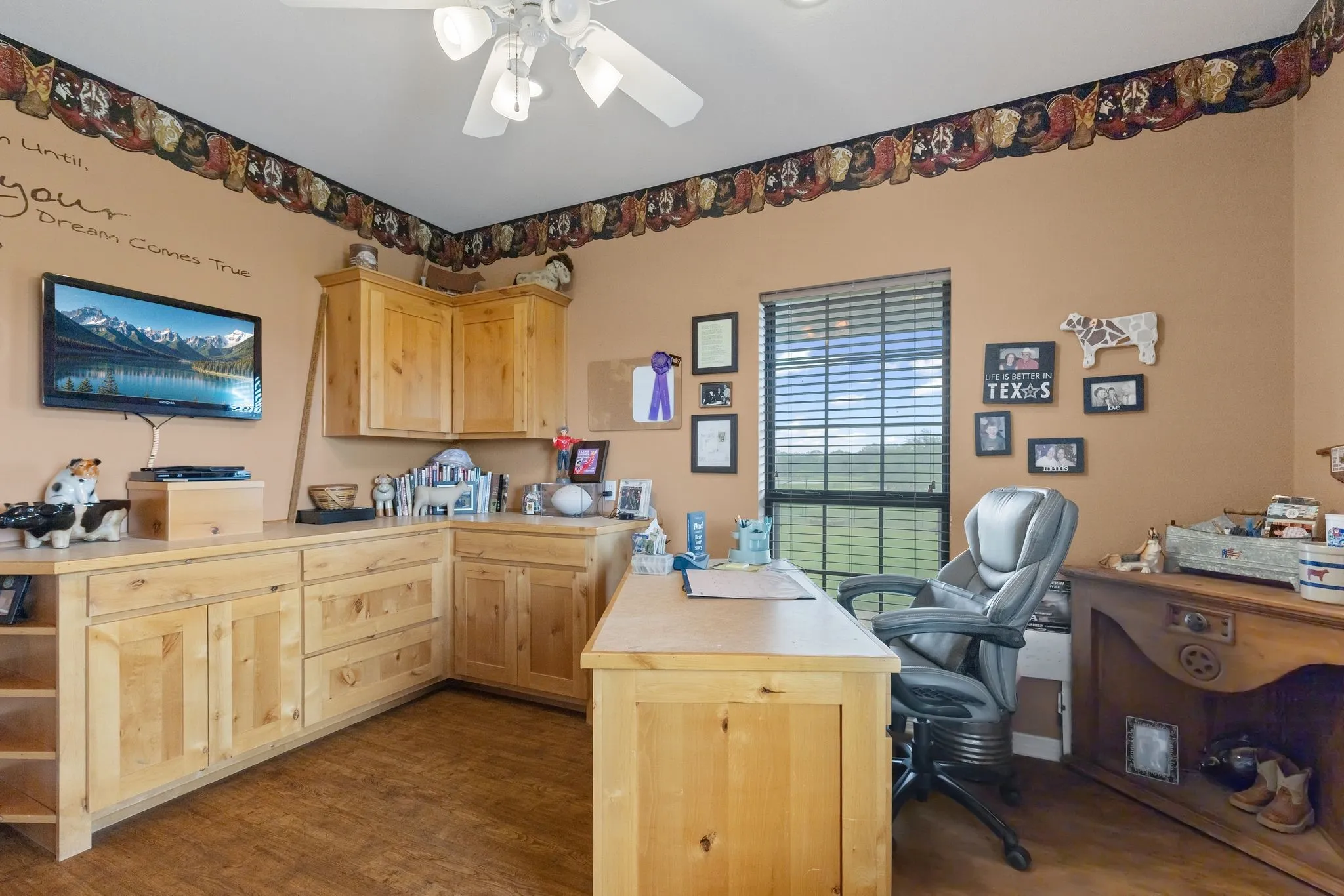 Spacious Bedroom with great natural light. Currently utilized as a home office. Has Cabinetry for file cabinet and storage.