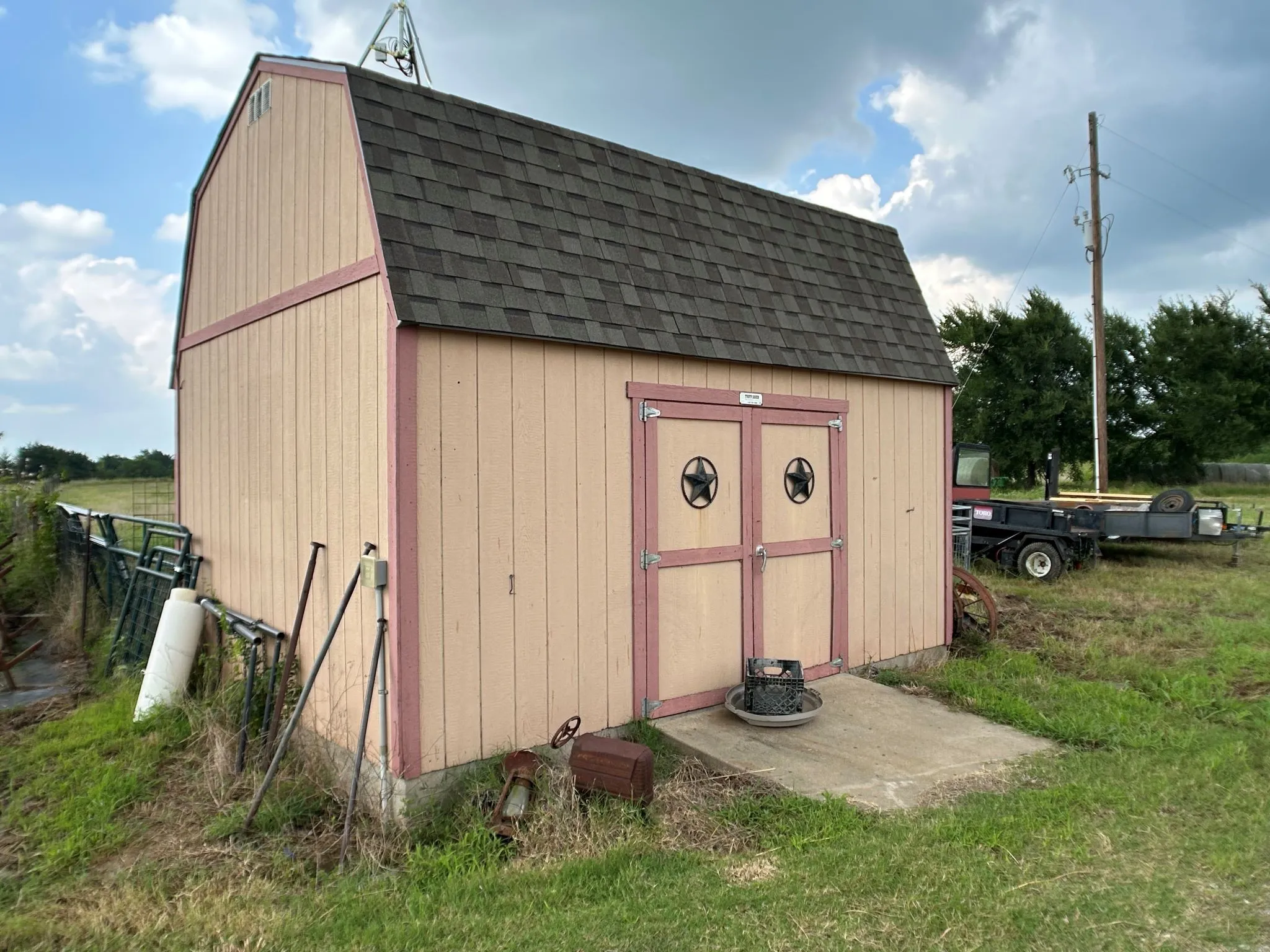 Tuff Shed is built upon concrete slab and has electric utility.