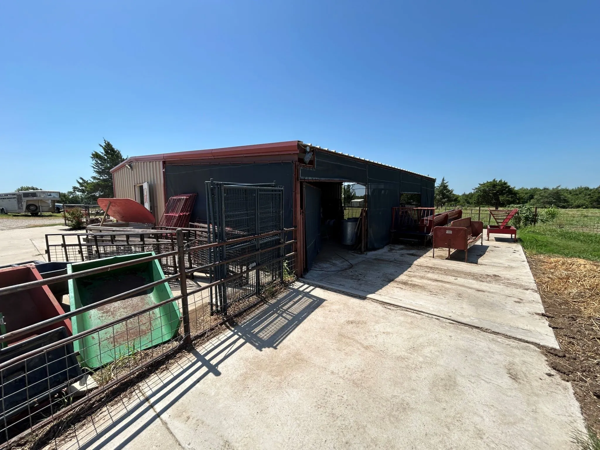 Rear of barn showing storage area and screened work space.