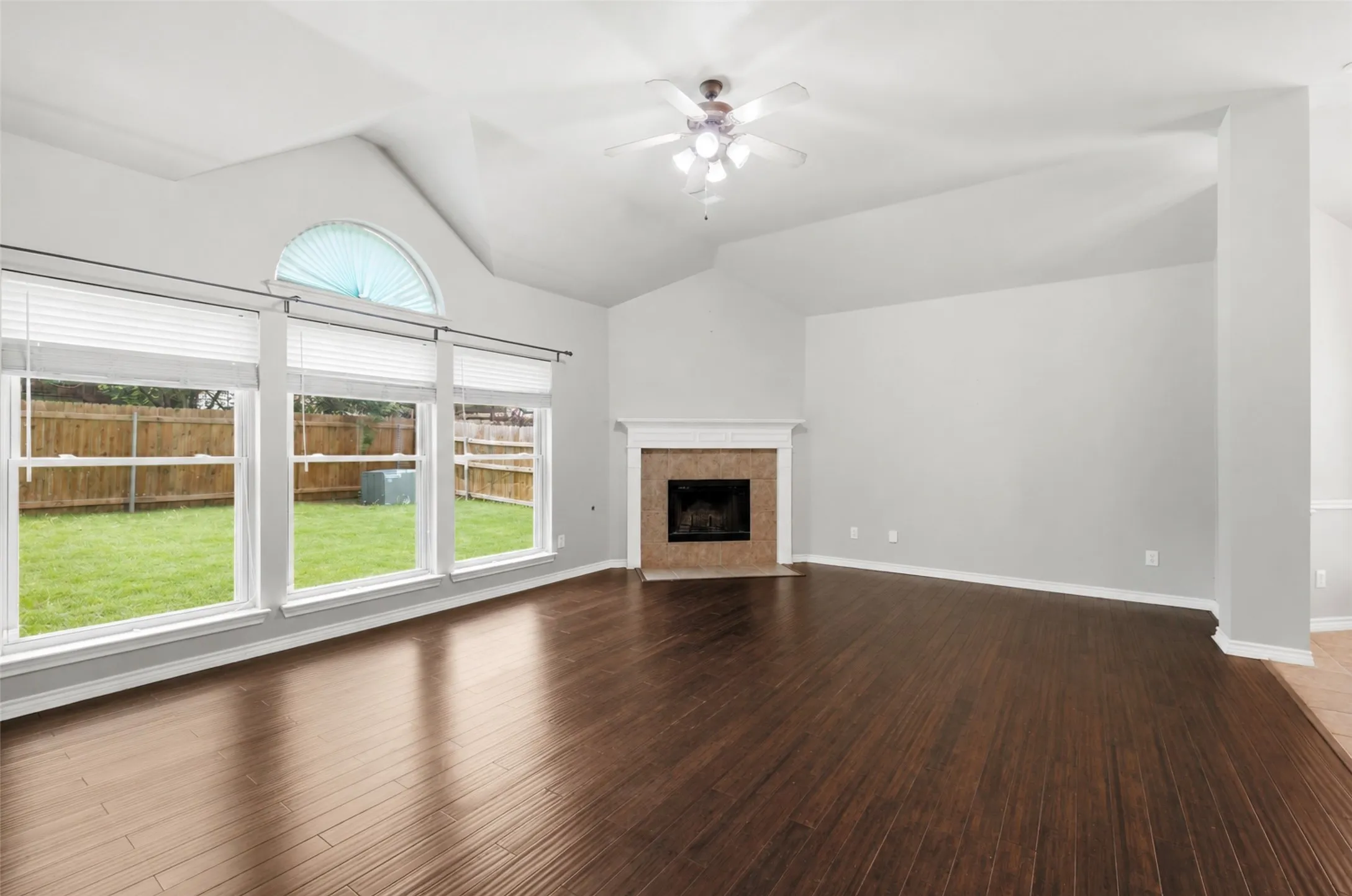 Large family room with another fireplace and lots of natural light!