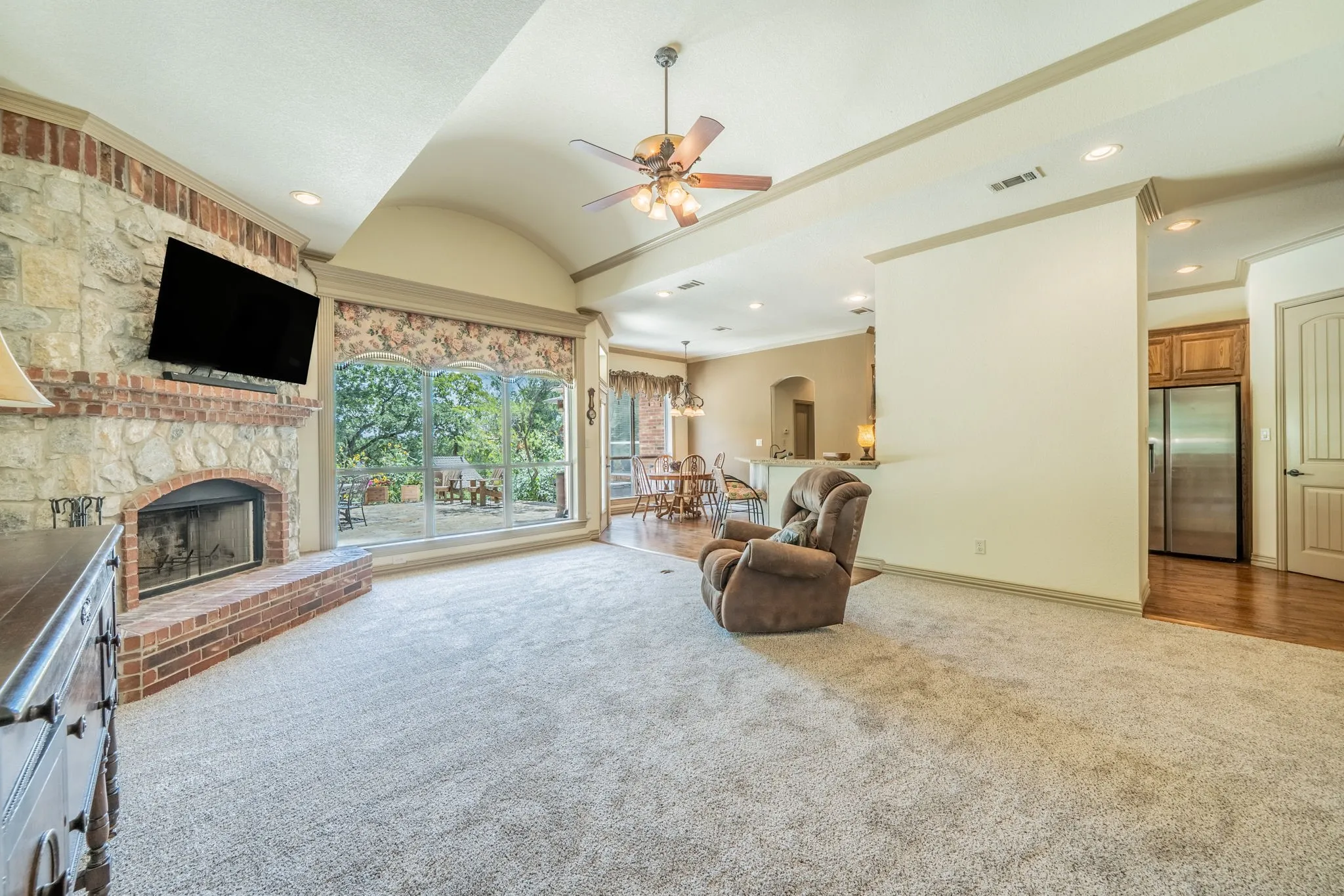 Open concept to kitchen and dining. Windows to enjoy the patio from inside.