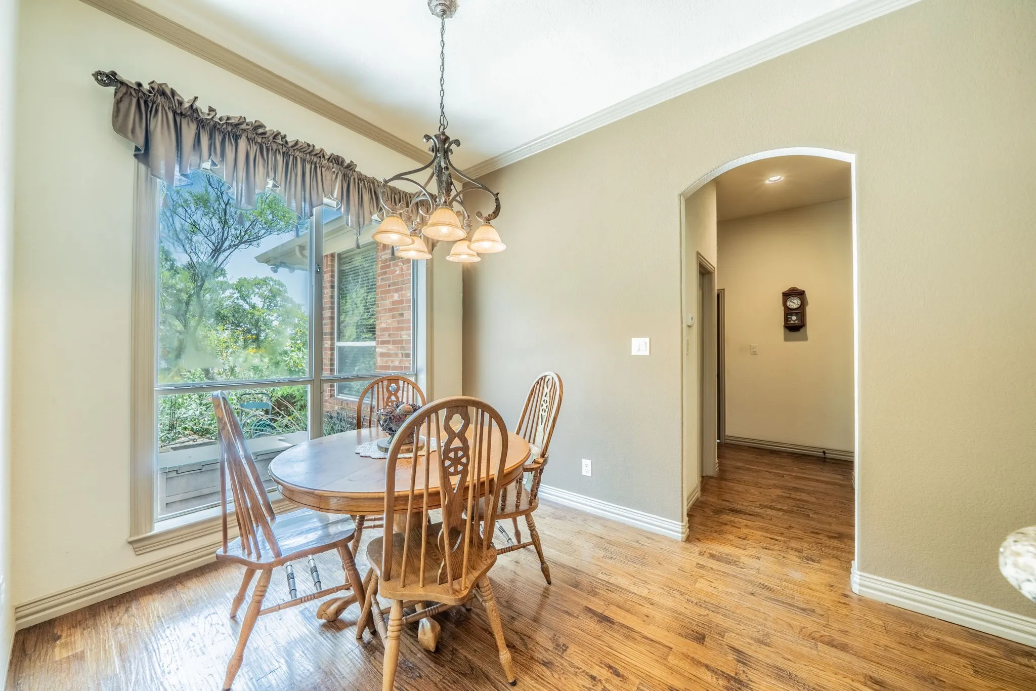 Breakfast Dining - wood flooring an windows to brighten the home.