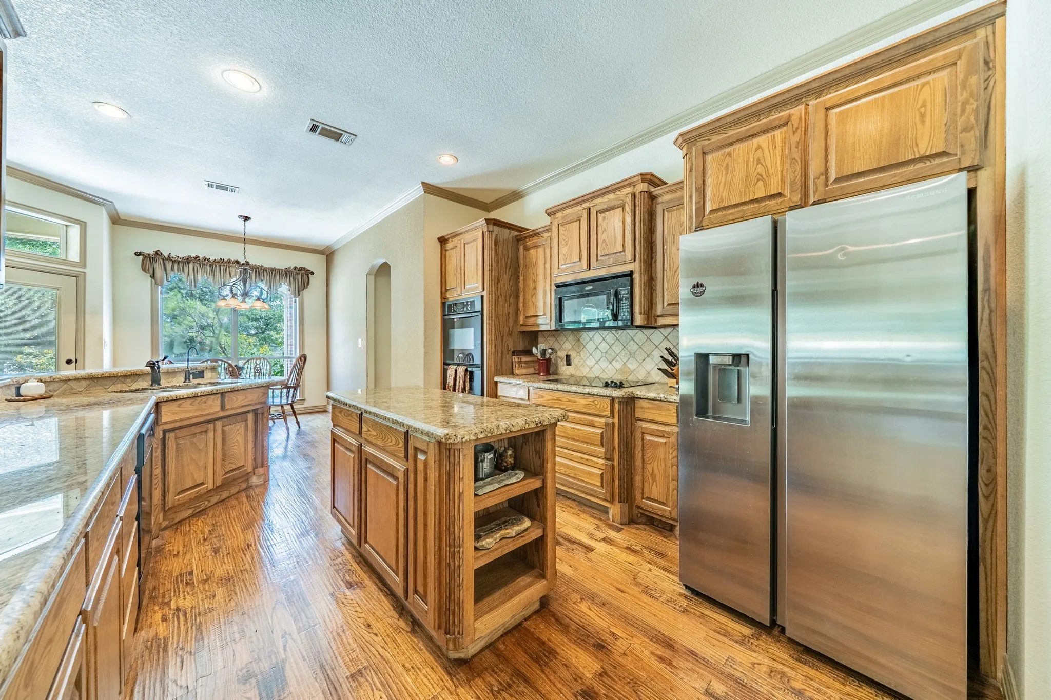 Kitchen open to both dining areas.