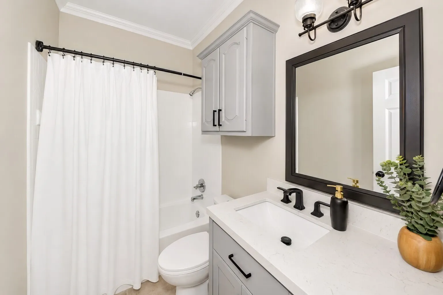 This full downstairs bathroom sits near the garage entry and just steps from the backyard door, making it easy for guests or anyone coming in from outside. Its location next to the downstairs bedroom — and close to the kitchen — creates a convenient setup for multi-generational living or a private guest space. It’s a smart, accessible bathroom that fits the flow of everyday life.