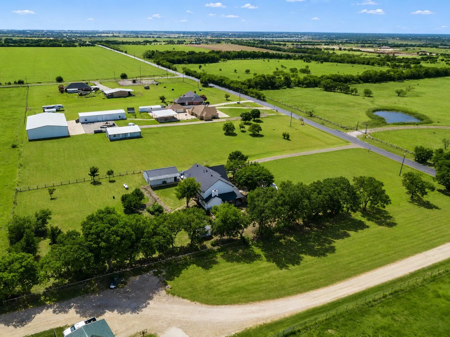 West View-Shows the west fence line, the 24x36 shed area, and the western landscape extending beyond the property.