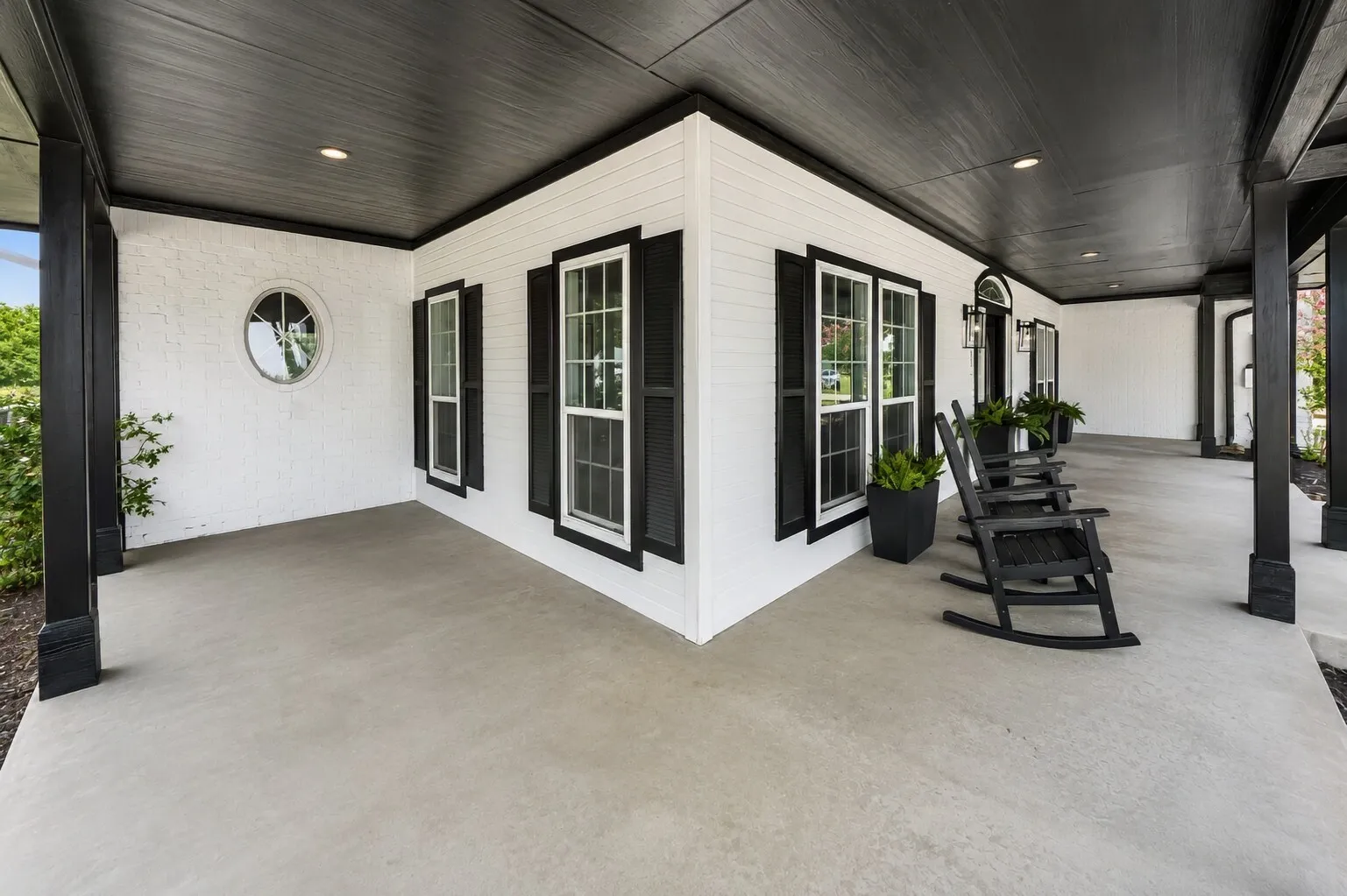 The porch curves just outside the dining room windows, catching the morning sun from the east and giving you an easy spot for that first cup of coffee. It’s a natural place for breakfast to drift outdoors, with open views and the neighbor’s cattle grazing next door adding a quiet, everyday backdrop. The whole stretch feels calm, simple, and made for slow starts to the day.