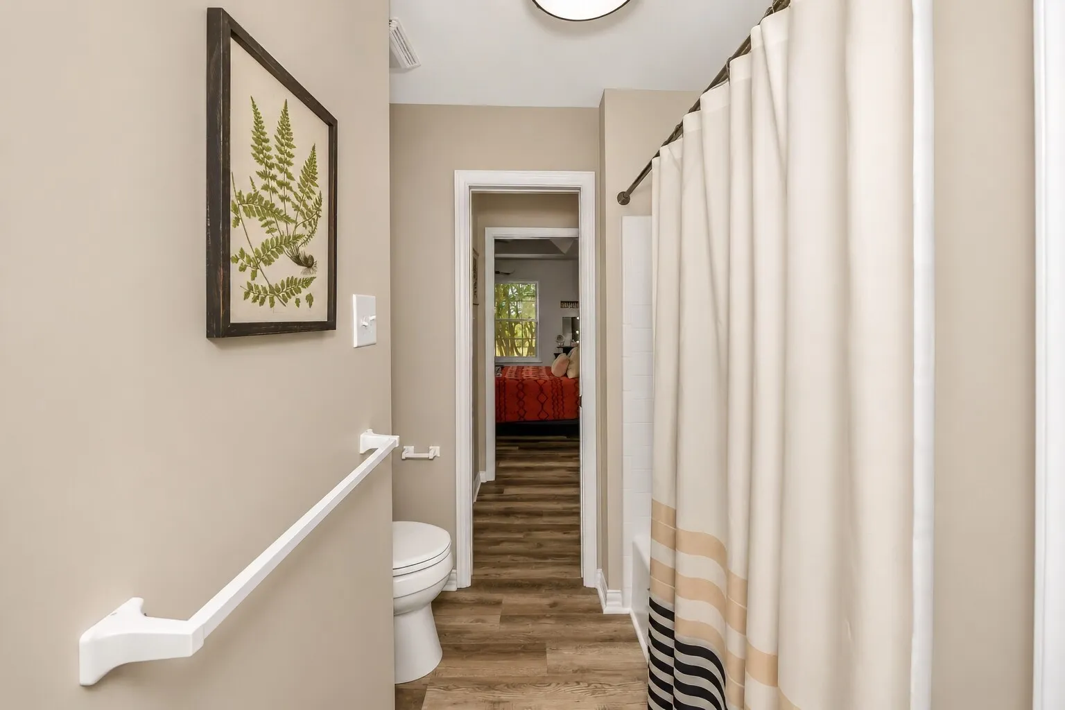 The Jack-and-Jill bathroom connects the two upstairs bedrooms and features a practical shower/tub combo that works for all ages. The layout keeps everything easy and efficient, with each bedroom having direct access while still maintaining privacy. It’s a bright, functional space designed for everyday living.