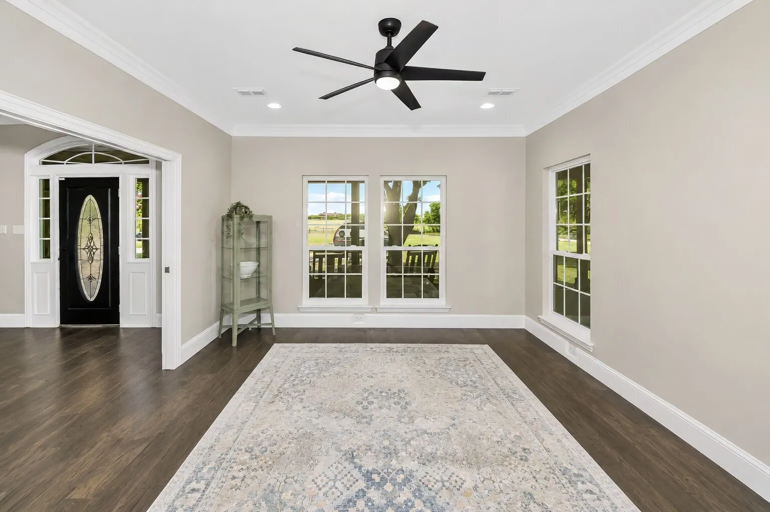 Pocket doors slide neatly into the walls as you enter the dining room, keeping the space open when you want flow and closed when you want a quieter setting. The room stays bright and streamlined, with clean lines and a layout that works for everyday meals or something a little more formal.