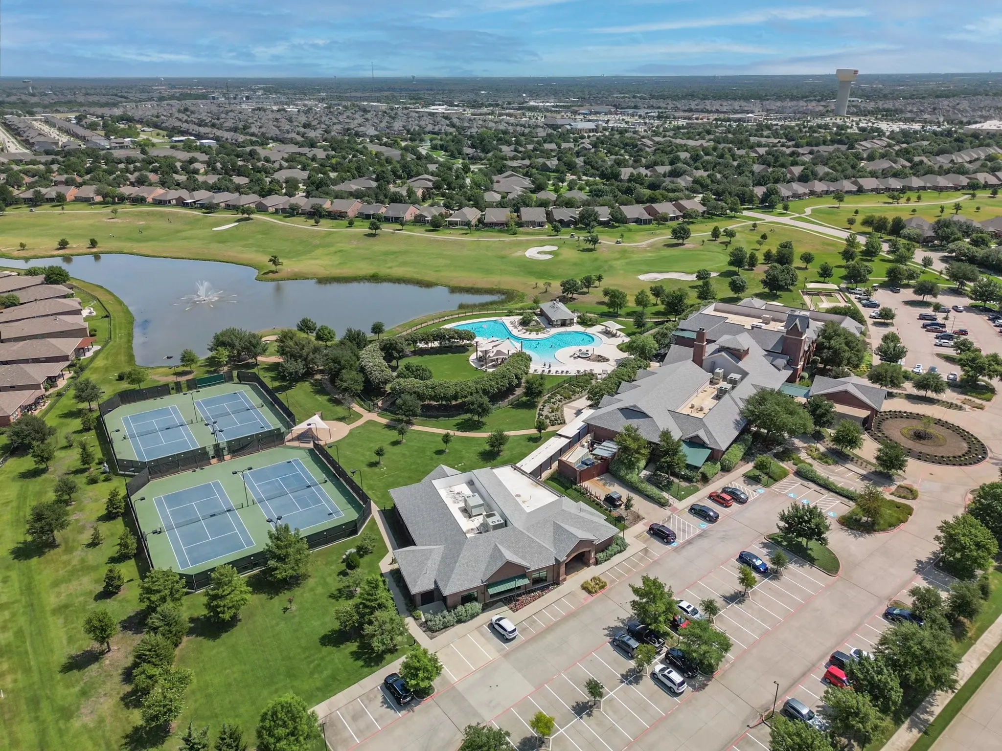 Main Village Center aerial view highlighting nearby amenities, green spaces, and scenic surroundings.