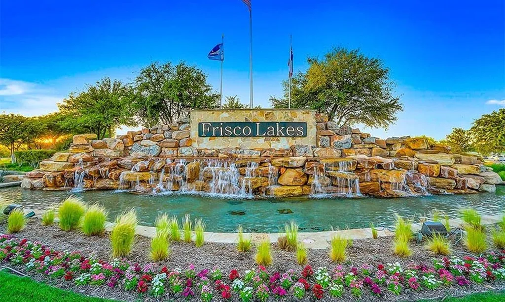 Stunning stone entrance with cascading water features welcomes you into the highly sought-after Frisco Lakes community.