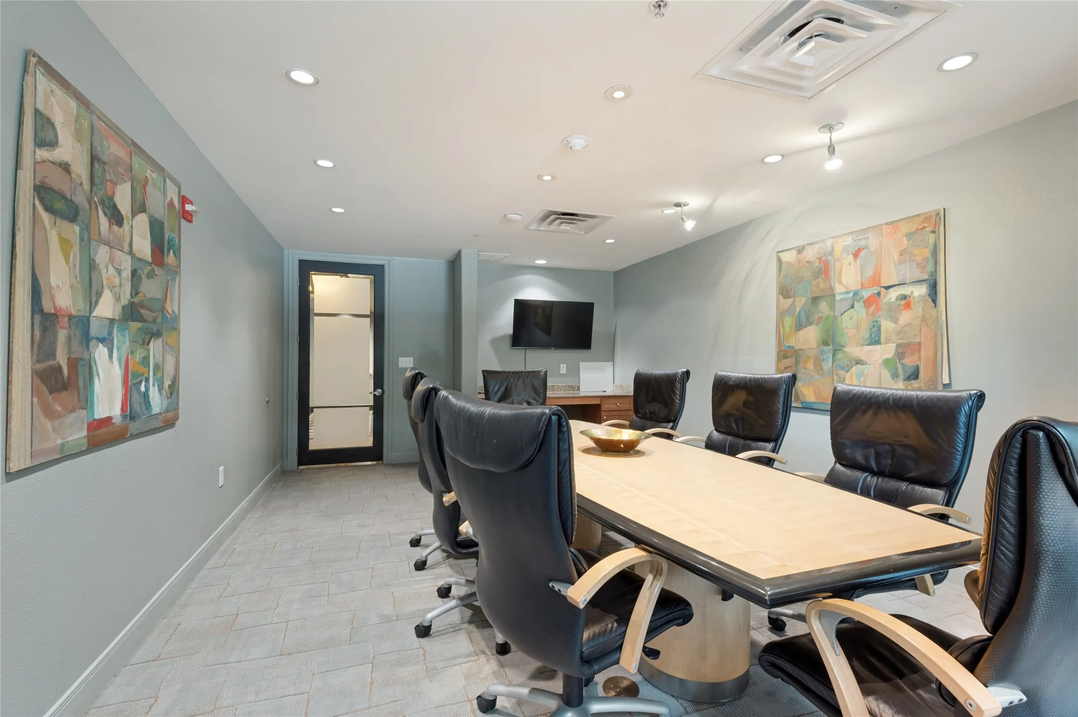 Conference room with recessed lighting, integrated ceiling ventilation, and tile flooring