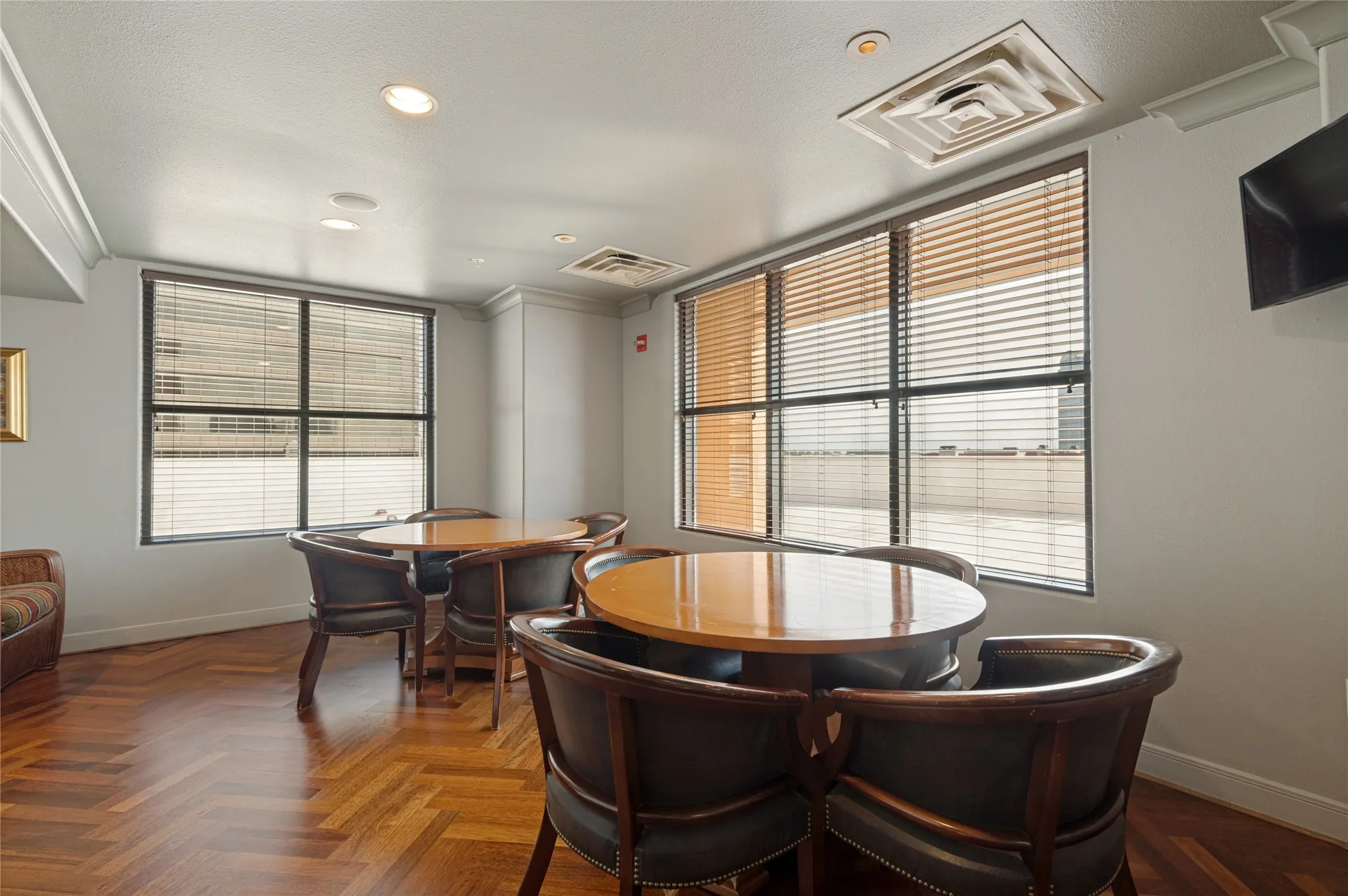 Herringbone wood-finish flooring complements the neutral wall tones