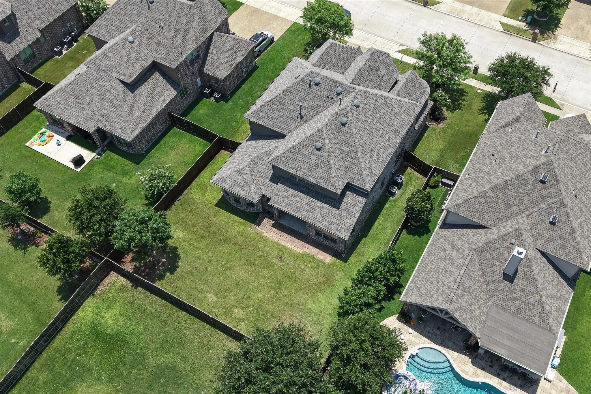 Expansive property featuring a large backyard, mature trees, and privacy fencing